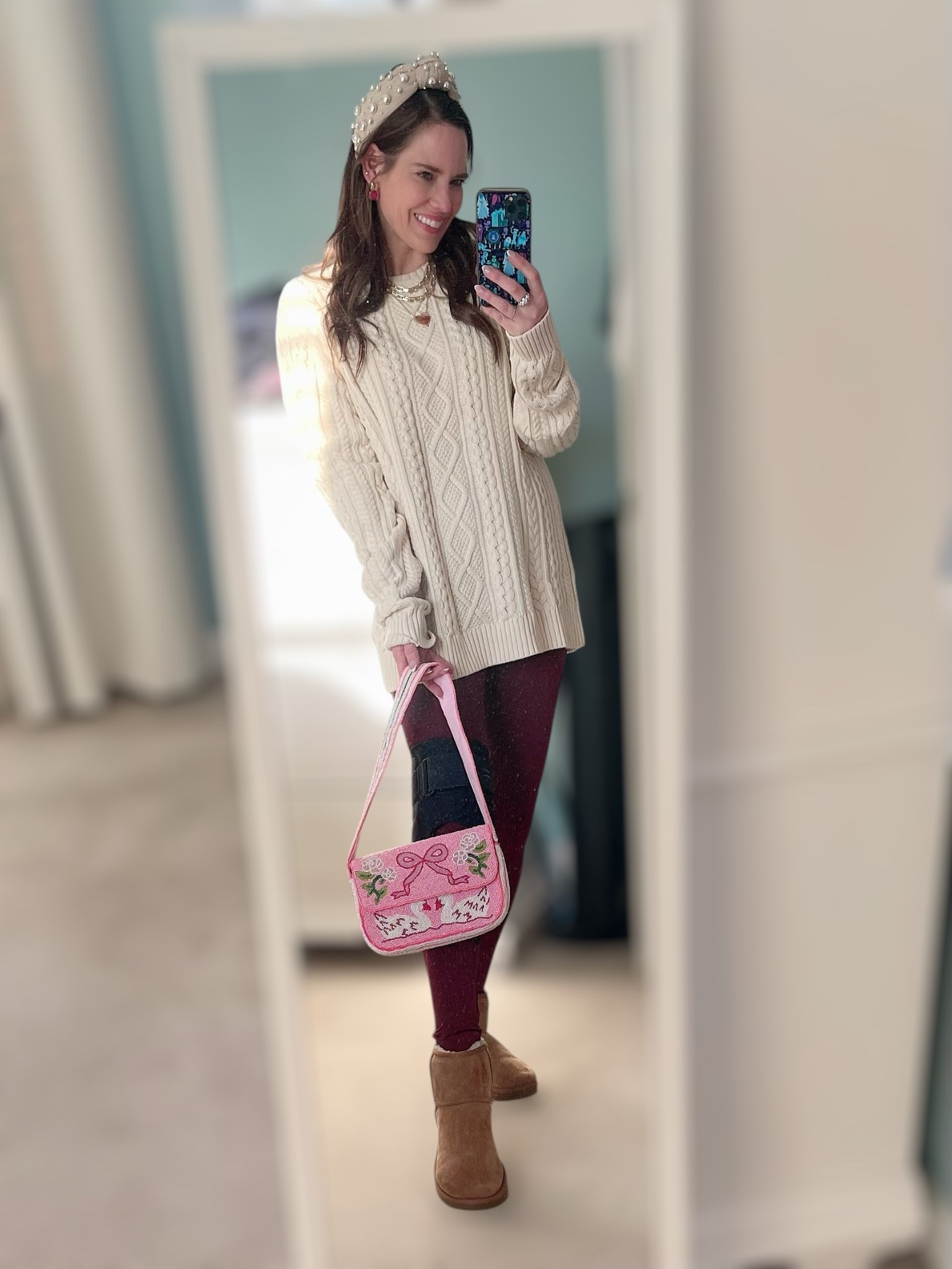 Cozy Cable Knit Winter Look 🤍✨

An easy, cozy winter outfit that still feels pulled together 🤍 I’m wearing an oversized men’s cable-knit sweater for that relaxed, slouchy fit—perfect for leggings days, school drop-off, errands, and casual winter weekends. Paired with burgundy leggings for a rich seasonal pop, classic UGG mini boots for warmth and comfort, and a pearl headband to instantly elevate the look ✨ Finished with layered gold necklaces, statement pink gemstone earrings, and the cutest beaded swan shoulder bag for a feminine, playful touch. This is one of those effortless winter outfits that’s comfy enough for all day but still polished and cute ☕👜❄️

cozy winter outfit, cable knit sweater outfit, oversized sweater look, leggings outfit winter, comfy winter outfit, UGG mini boots outfit, neutral winter outfit, pearl headband style, casual chic winter look, everyday winter outfit, women’s cozy fashion, casual mom outfit, affordable winter fashion, Amazon sweater find, burgundy leggings outfit, cold weather casual style

#LTKHoliday #LTKFindsUnder50 #LTKFindsUnder100