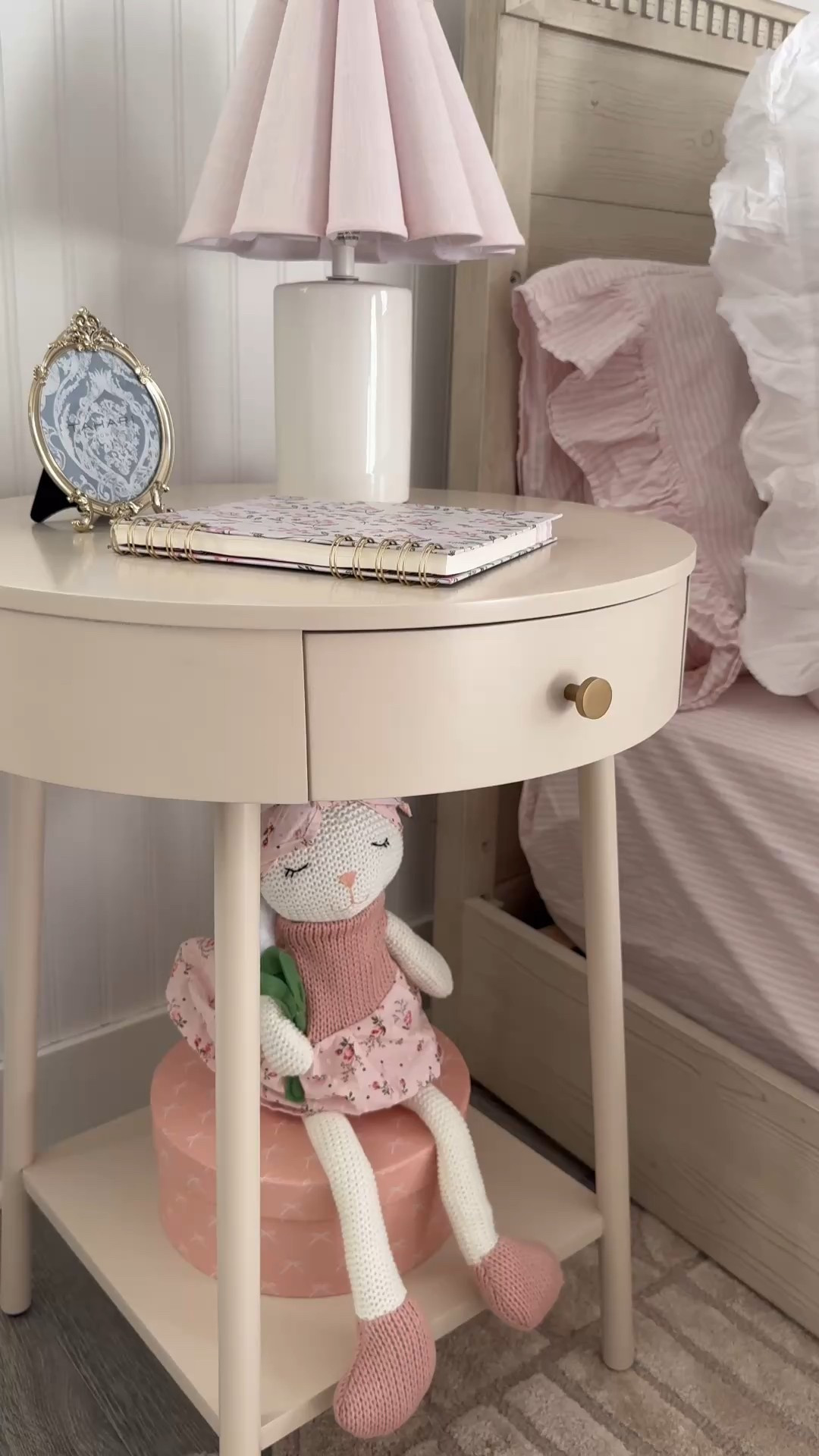 Girl bedroom decor
Round nightstand with drawer
Pink nightstand
Pink table lamp 
Fluted lamp shade
Plush bunny stuffy
Pink stripe bedding
Ruffle bedding
Pink bow coquette wall art
Bow decor
Bow wall art print
Gold frame 
Girl room decor
Big girl room reveal 

#LTKKids #LTKHome #LTKBaby