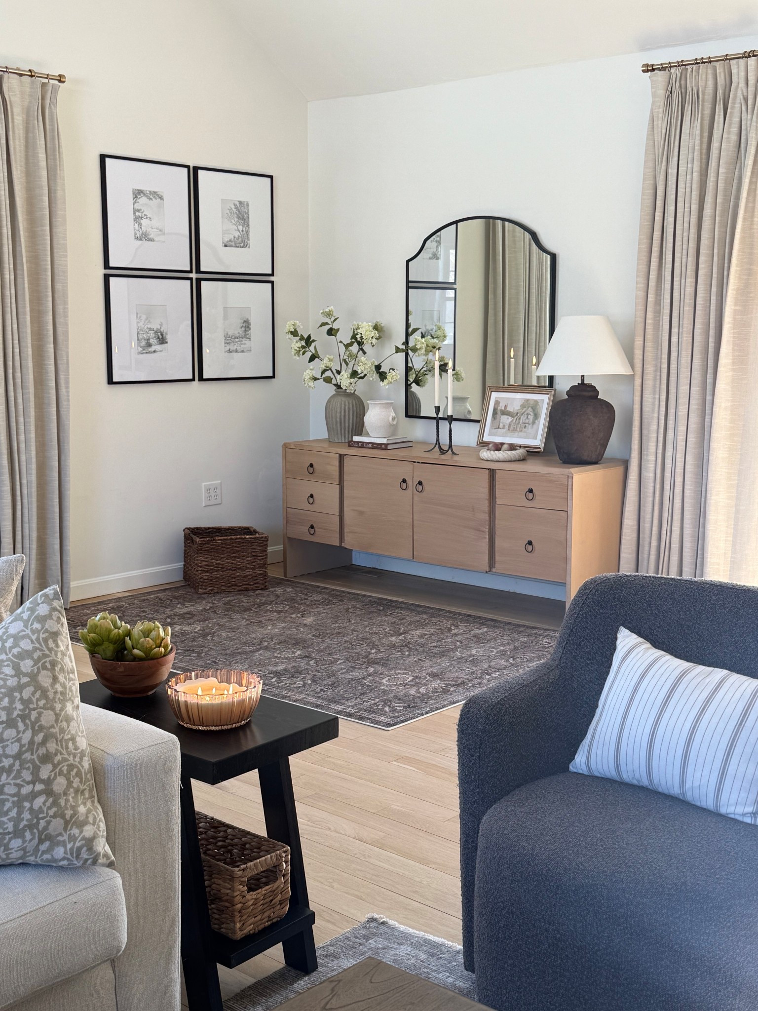 Adding in some spring touches to our family room. We had lots of snow outside, but can add some spring inside. Floral landscape art pretty candles.

#LTKhome #LTKstyletip