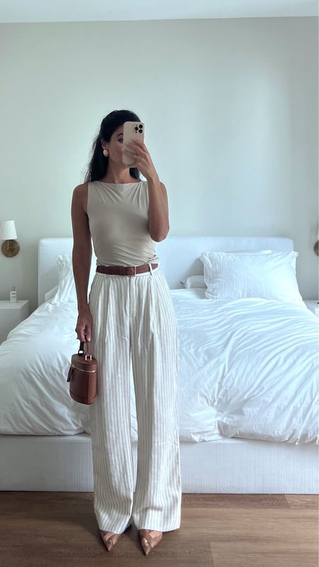 Tried these linen pants because they were a top seller on aber and they’re so cute - I didn’t steam them at all and the wrinkle looks fine! Always concerned about wrinkles when ordering linen but these passed the test. Wearing size 25 regular in tan stripe. Loved the tank, wearing size XS it’s lined in the bra area but still thin. 

Ps they have 15% off everything rn! Xx

#LTKWorkwear #LTKFindsUnder50 #LTKFindsUnder100