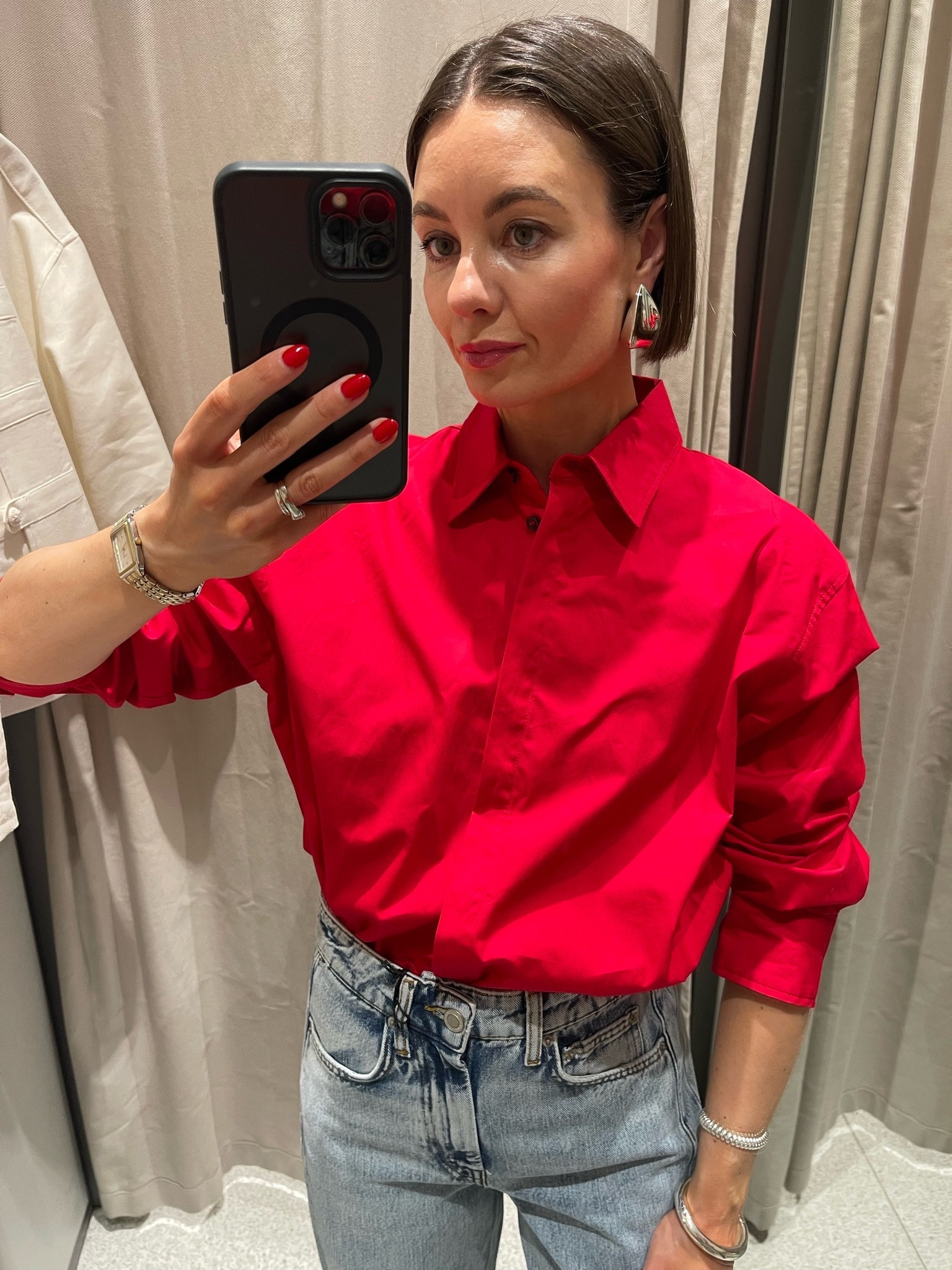 Love this red so much! I went for a S, because this is the only size they had but it is oversized so I would go for your usual size.