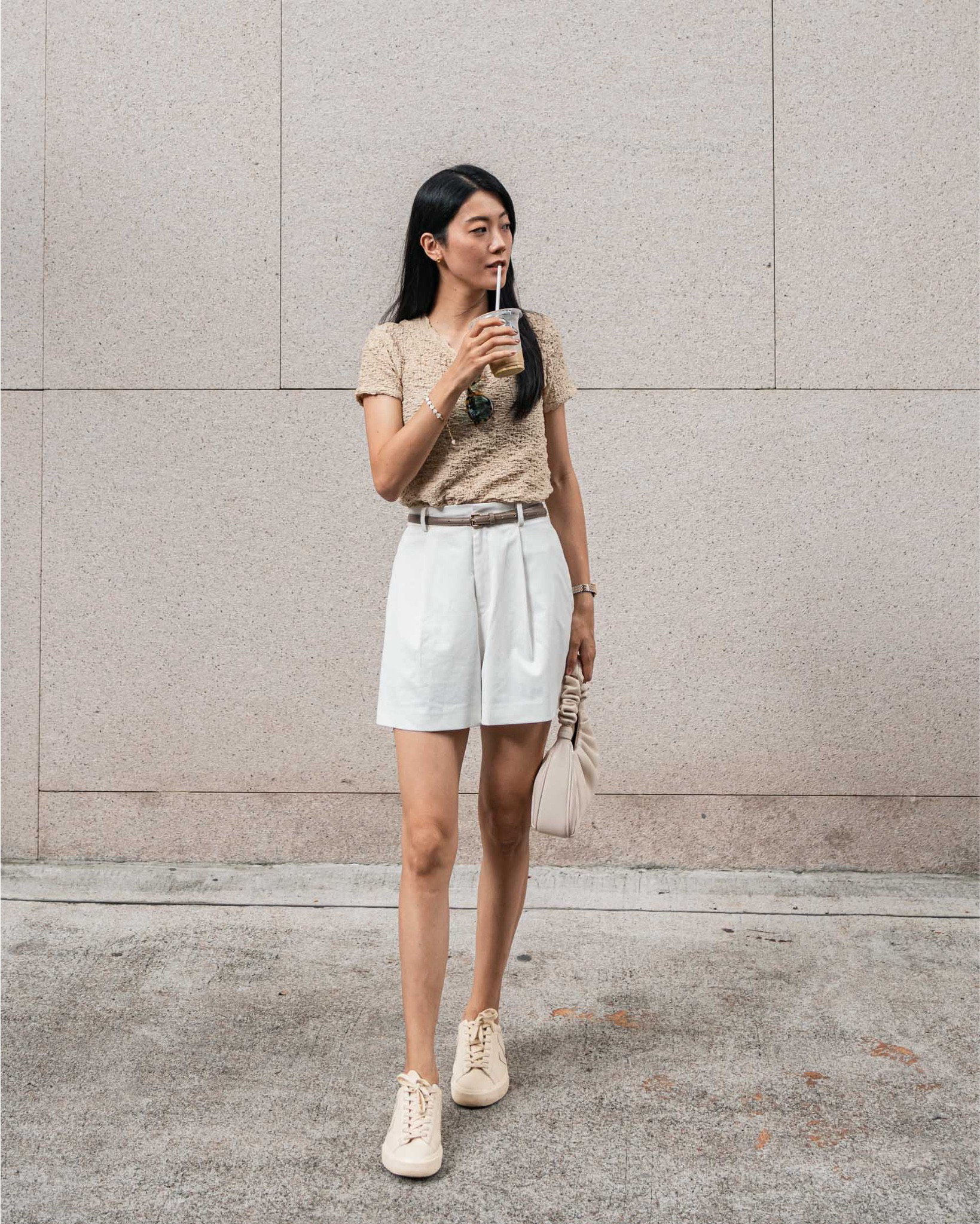 Summer OOTD 🌞 Uniqlo beige shirred short-sleeved tee, white pleated shorts, taupe skinny belt, Veja Campo cream sneakers, JW Pei Gabbi bag, tortoiseshell sunglasses

#LTKasia #LTKsummer