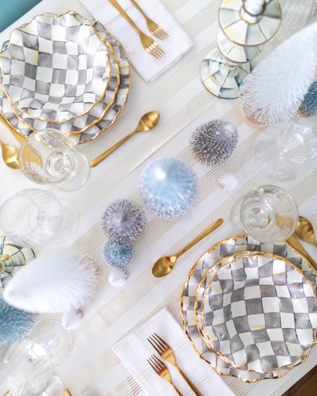 A chic tablescape thanks to MacKenzie-Childs including their Sterling Check fluted ceramic plates and bowls as well as gold flatware and classic drinking goblets

#LTKhome #LTKfindsunder100 #LTKSeasonal