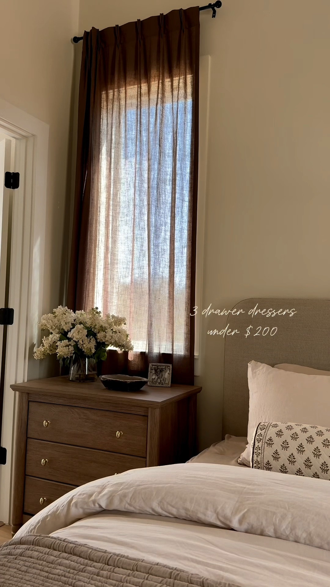 Subtle ways to add fall touches with moody sheer brown curtains. I love these from Amazon. I get asked so often about these 3 drawer dressers I used as nightstands as well. Great quality and have power plugs too! Under $200 each. I swapped the knobs with polished brass from Amazon. I’ll link those as well! The upholstered bed is a fraction of the cost of my Sixpenny slipcovered bed at my home! Still an investment piece since it is furniture but it’s around $1200 instead of $4000! This rug is soft and stain resistant. Neutral but gives your space some texture.

#LTKHome #LTKSeasonal