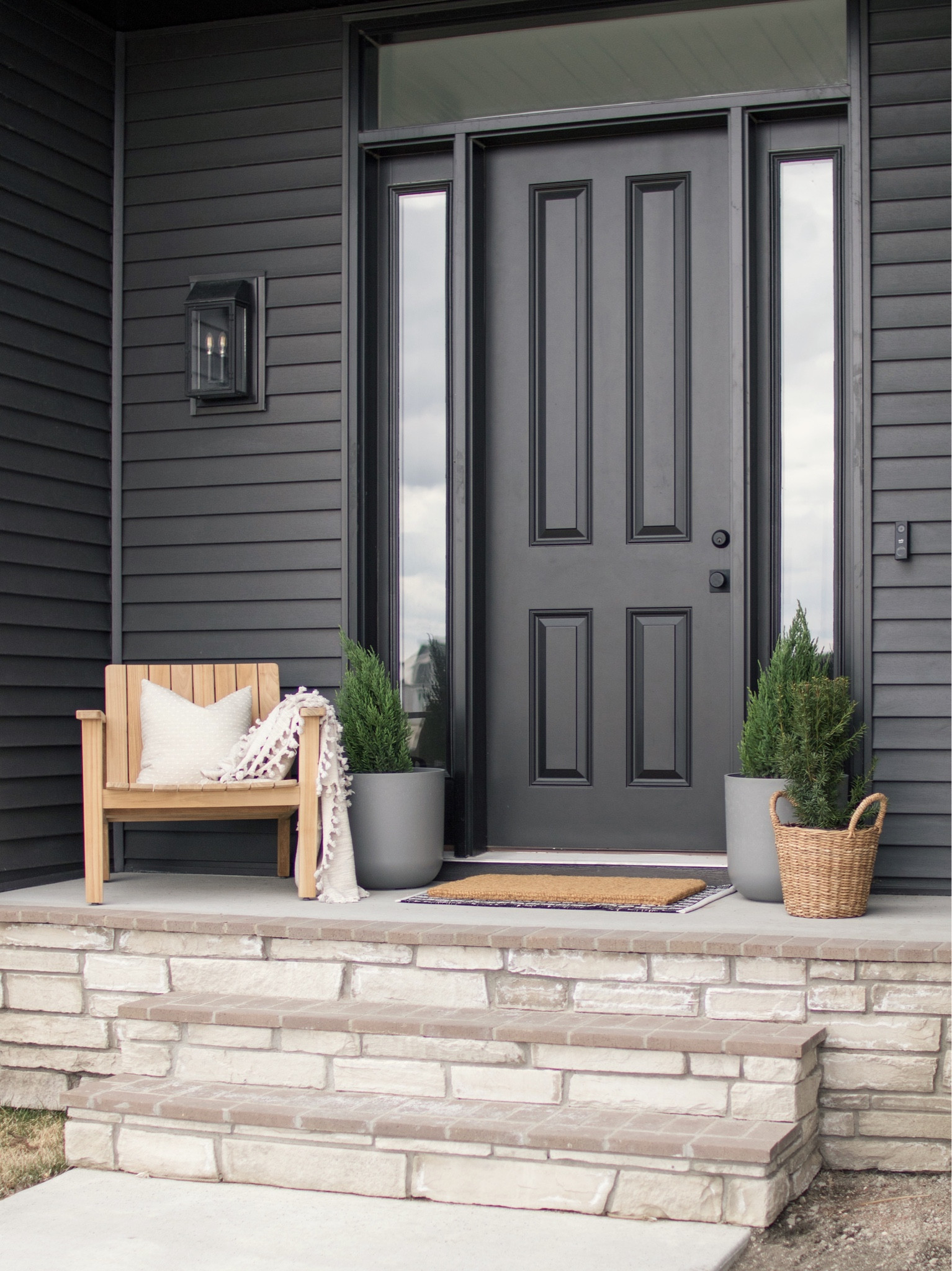 Shop my front porch! I love this wood Adirondack chair against the black exterior!

#LTKsalealert #LTKhome #LTKstyletip