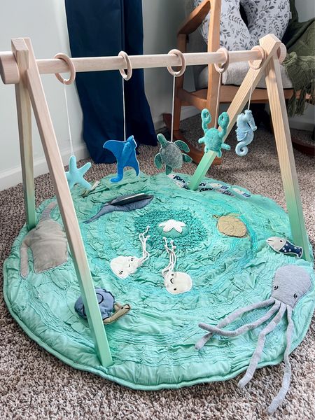 In need of some nursery inspo? This play gym with toys was one of my favorite items we had in Marvin’s nursery to set the theme and colors!

Nursery decor, baby gym, tummy time mat, gender neutral nursery