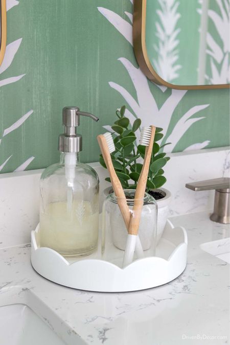 This scalloped white tray is perfect for the space between two sinks on a double bathroom vanity. Use it to corral countertop items like your soap pump, toothbrushes, and more! 

Bathroom decor, bathroom ideas, bathroom organization 

#LTKfindsunder50 #LTKfindsunder100 #LTKhome