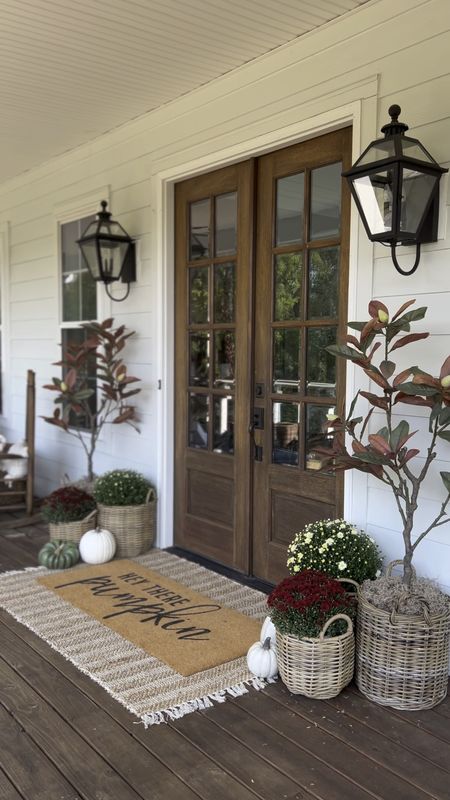 Front porch and door decor fall autumn harvest seasonal entry French double doors oversized layered scatter rug and doormat pumpkin magnolia trees faux artificial silk florals mums baskets wreaths outdoor lanterns wall sconces rocking chairs light fixtures southern modern farmhouse style home decor nearly natural amazon finds Etsy wayfair marshalls TJ Maxx home goods Walmart autumn oak trees 

#LTKhome #LTKSeasonal #LTKstyletip