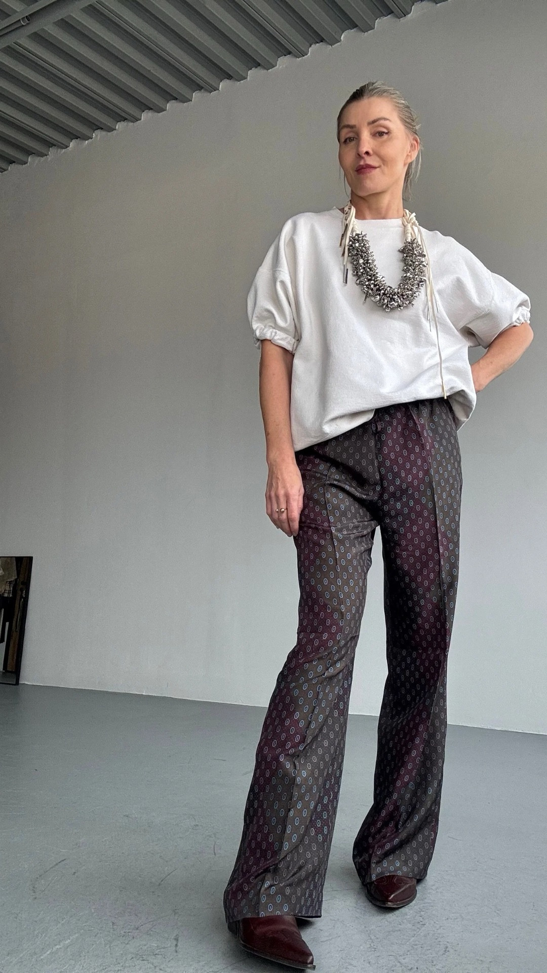 So I shopped.
I shopped for investment pieces at MyTheresa.

This isn’t about trends. It’s about how I style investment pieces I actually wear, starting with one of my favorite finds this season - Dries Van Noten silk pants.

The length, the cut, the drape, the way they move. Best silk pants I’ve ever worn.
And if you’ve been here a minute, you’ve seen this Rachel Comey sweatshirt styled a hundred ways. Still not tired of it.

This is what I call paradox styling. 
~ Dressy silk pants with a lived-in sweatshirt
~ Western boots for weight and grounding
~ A statement necklace that doesn’t care if it’s “too much” for a Wednesday

It’s an everyday look, but it feels original. Because of the nuance. The unexpected mix. The textures. The contrast. Throw a coat on top and you’re set for fall.

And as you know me, I will be showing at least five more looks with these pants! Because great pieces don’t sit still.

#over50style #paradoxstyling #investmentdressing #mytheresa #10killeroutfits #howtowearit #driesvannoten #silkpants #ltk 

#LTKOver40 #LTKSeasonal #LTKStyleTip