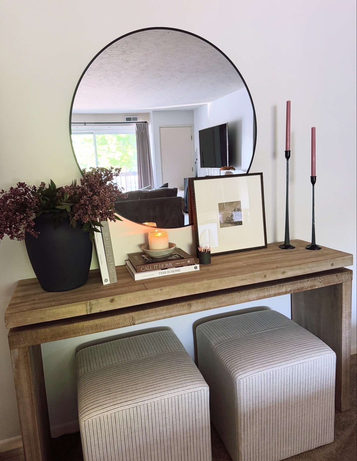 Spring console table, wayfair console table, pink candlesticks, iron candlesticks, black candlesticks, ottomans, round mirror, berry stems

#LTKSeasonal #LTKSaleAlert #LTKHome