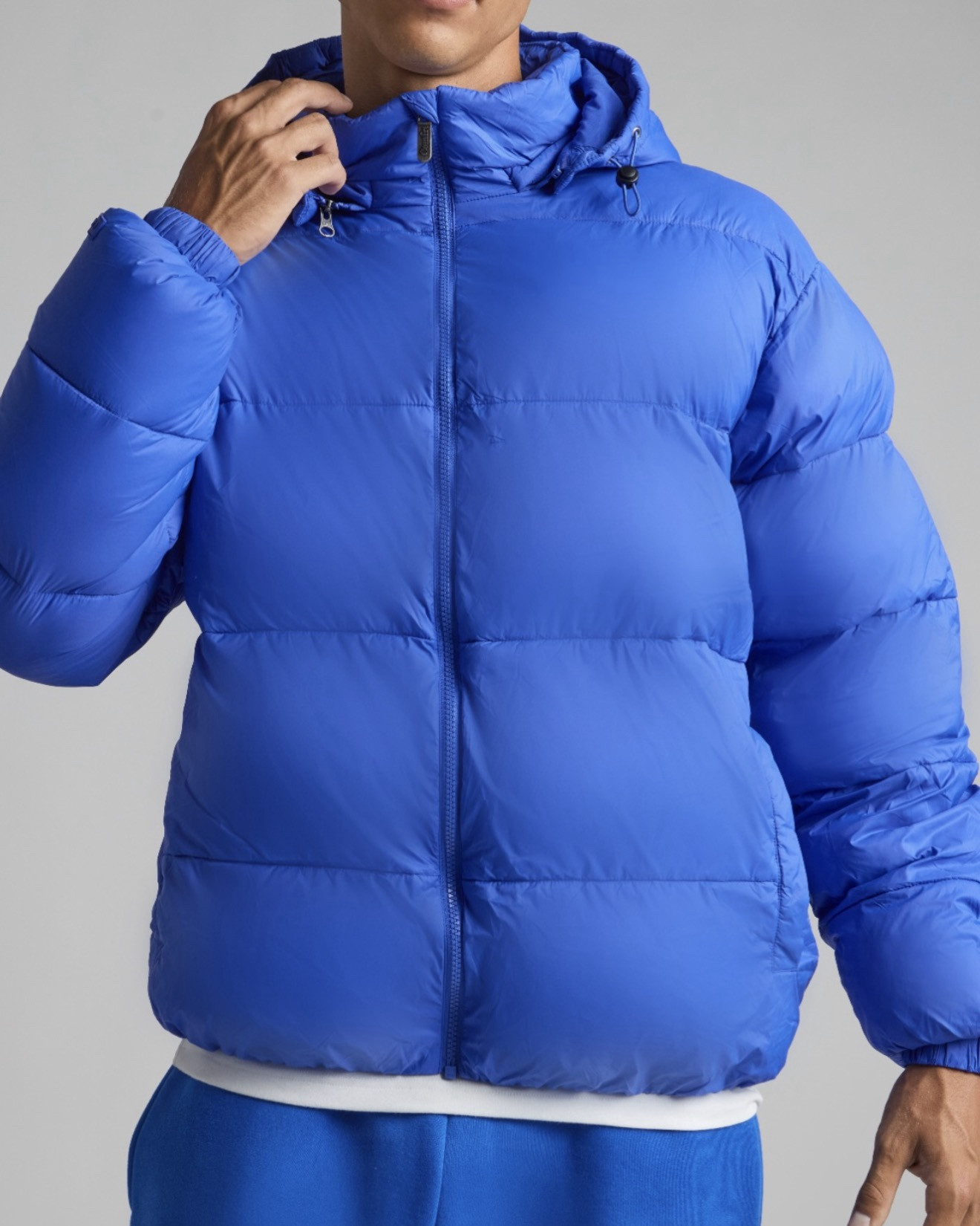 Stay warm without weight. Our lightweight puffer jacket is filled with Primaloft® insulation—engineered for ultimate warmth, softness, and breathability. Designed with a water-resistant shell to keep you dry and comfortable through unpredictable weather. Features include a removable hood for versatile wear, two front snap pockets, and an internal pocket for essentials. The perfect balance of performance and everyday comfort—built to move with you from city streets to weekend escapes.

3 Piece Removable Hood
Water Resistant
Primaloft Fill for ultimate warmth
Relaxed Fit

#LTKActive #LTKSaleAlert #LTKSeasonal