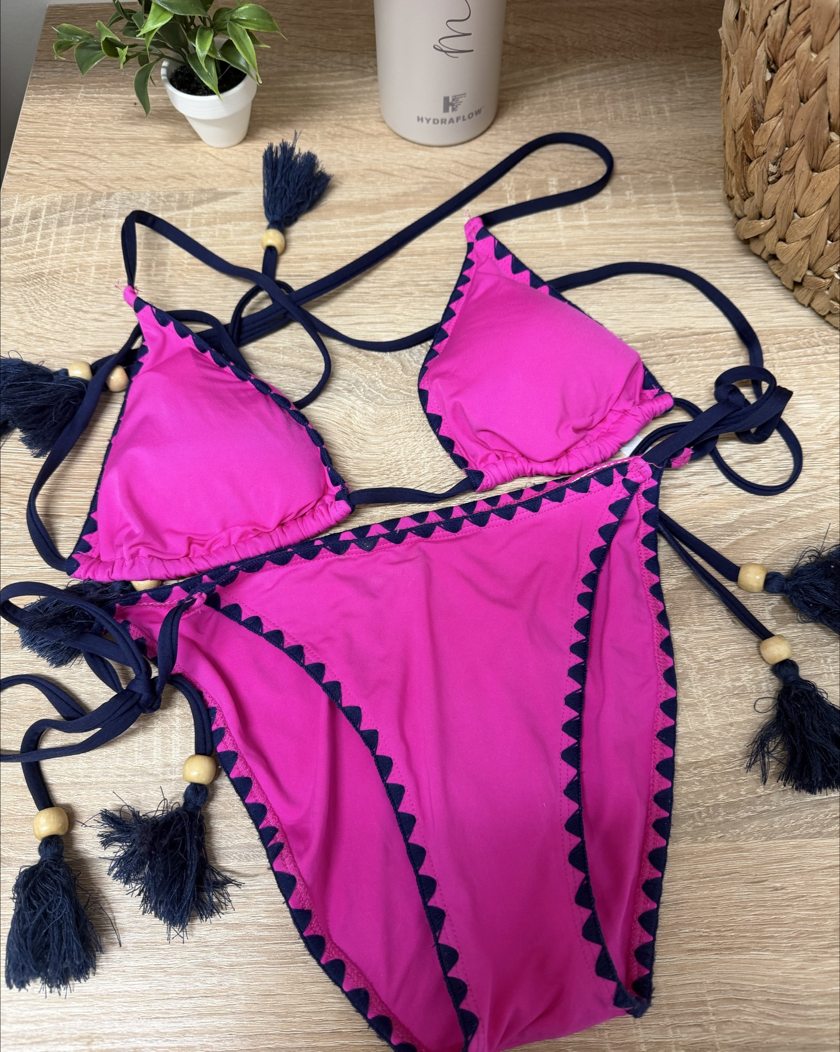 hot pink swimsuit with a geometric trim. Side tie bottoms with decorative tassels. 

Nylon & spandex - feels soft on the skin & has great stretch. 

Size SMALL and MEDIUM avail. On clearance! 

Bikini, bathing suit, triangle top, tie bottoms, pink bathing suit, two piece, on sale, pool, vacation, beach, summer, lake, resort 

#LTKSwim #LTKTravel #LTKootd