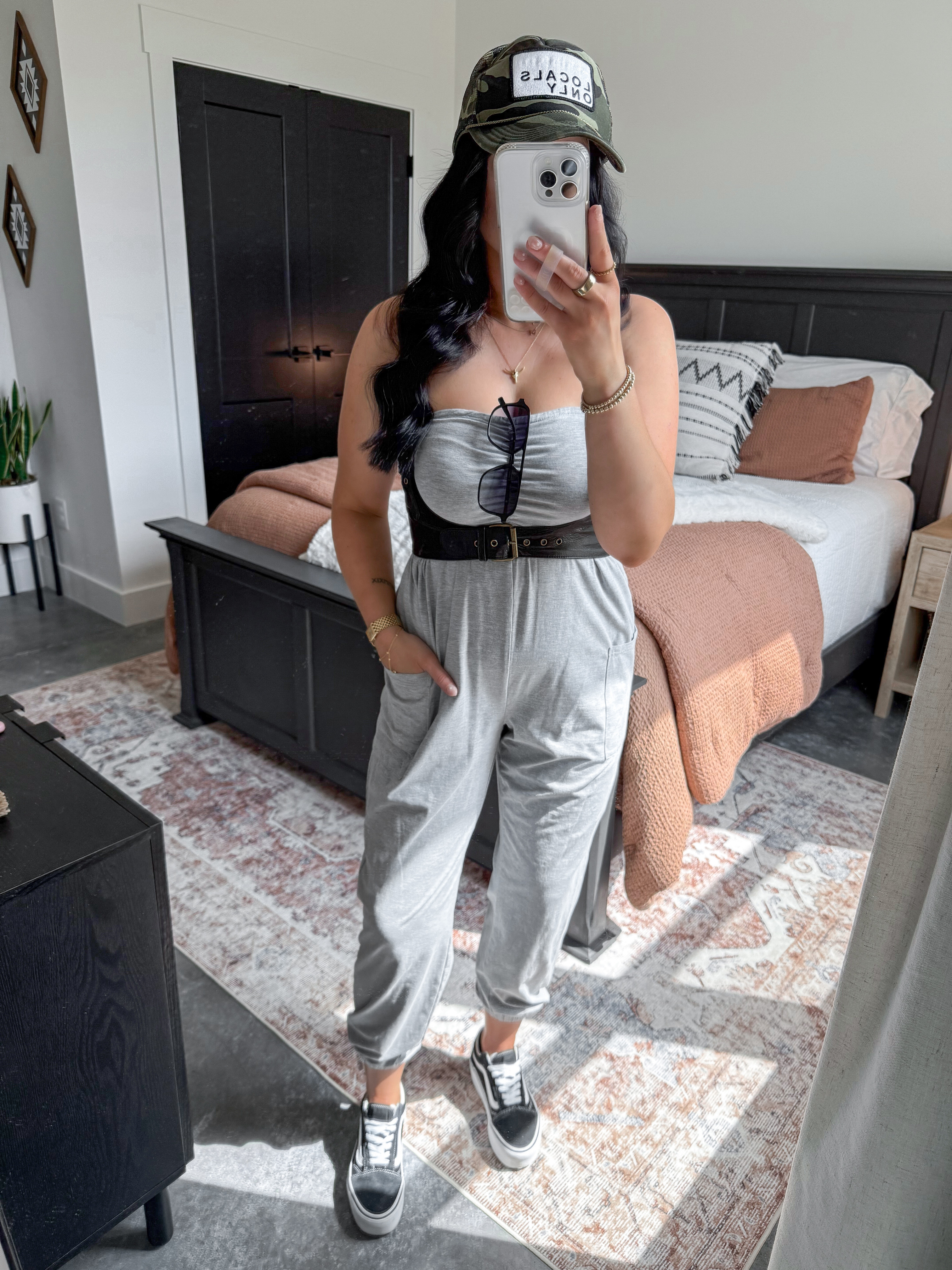 Jumpsuit - small
Harness - small

*I'm also linking my favorite black lace long sleeve top that you could wear underneath the jumpsuit to transition this look into fall! 

Comfy, casual, cool girl errands OOTD 🖤 This jumpsuit is so comfortable and comes in quite a few color options! I styled it with this black leather harness to bring in the waist and give it some shape. Finished the look with this camo trucker hat, my platform vans sneakers & some amazon sunglasses! 

 

 #LTKFindsUnder50 #LTKFindsUnder100 #LTKShoeCrush