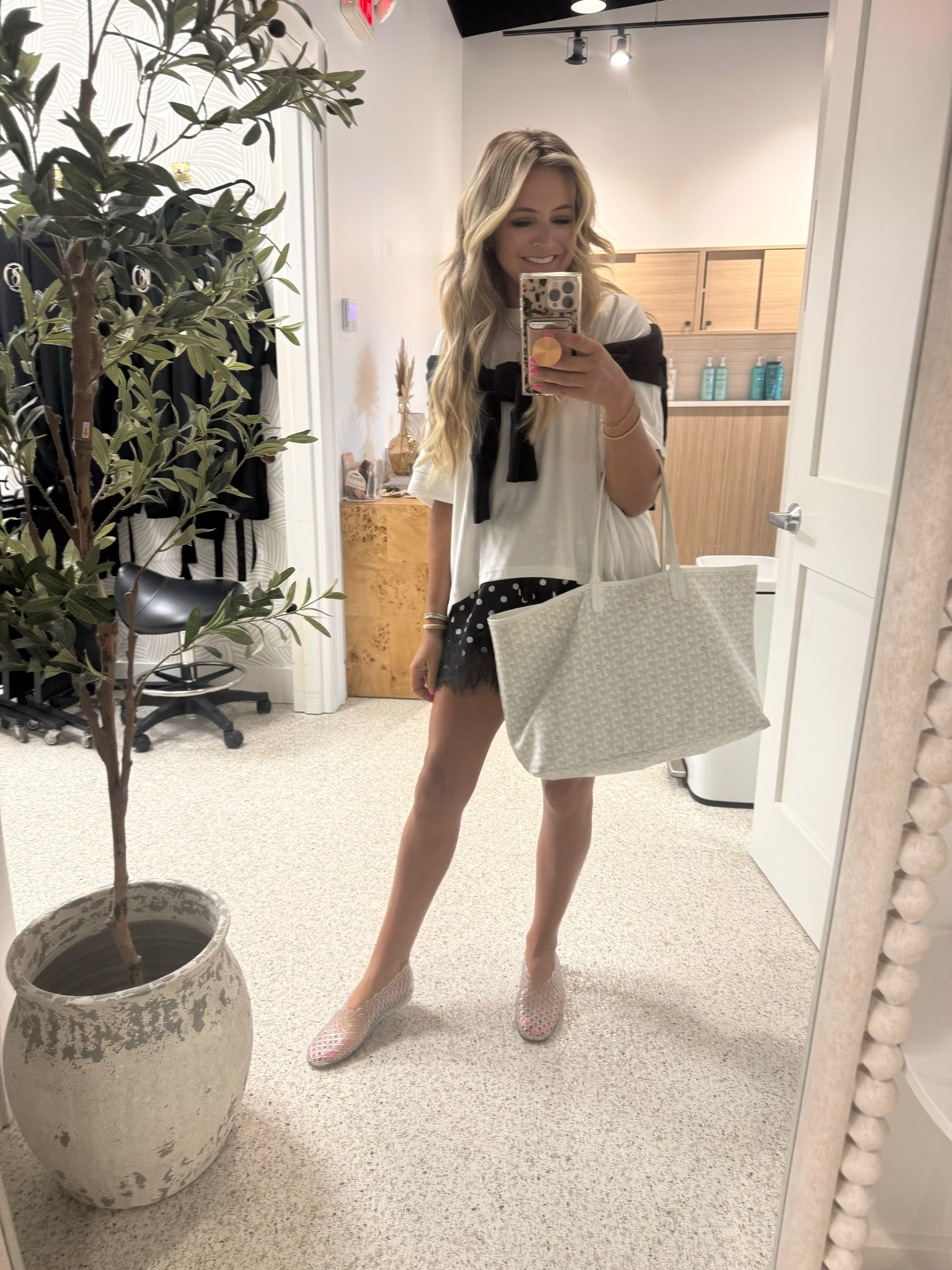 An easy black-and-white outfit that looks instantly put together 🖤 Styled an oversized white tee with lace-trim shorts, a sweater over the shoulders, jelly flats, and my favorite everyday tote. Perfect for errands, appointments, or a casual lunch!
 

 #LTKdayinmylife #LTKgrwm #LTKootd