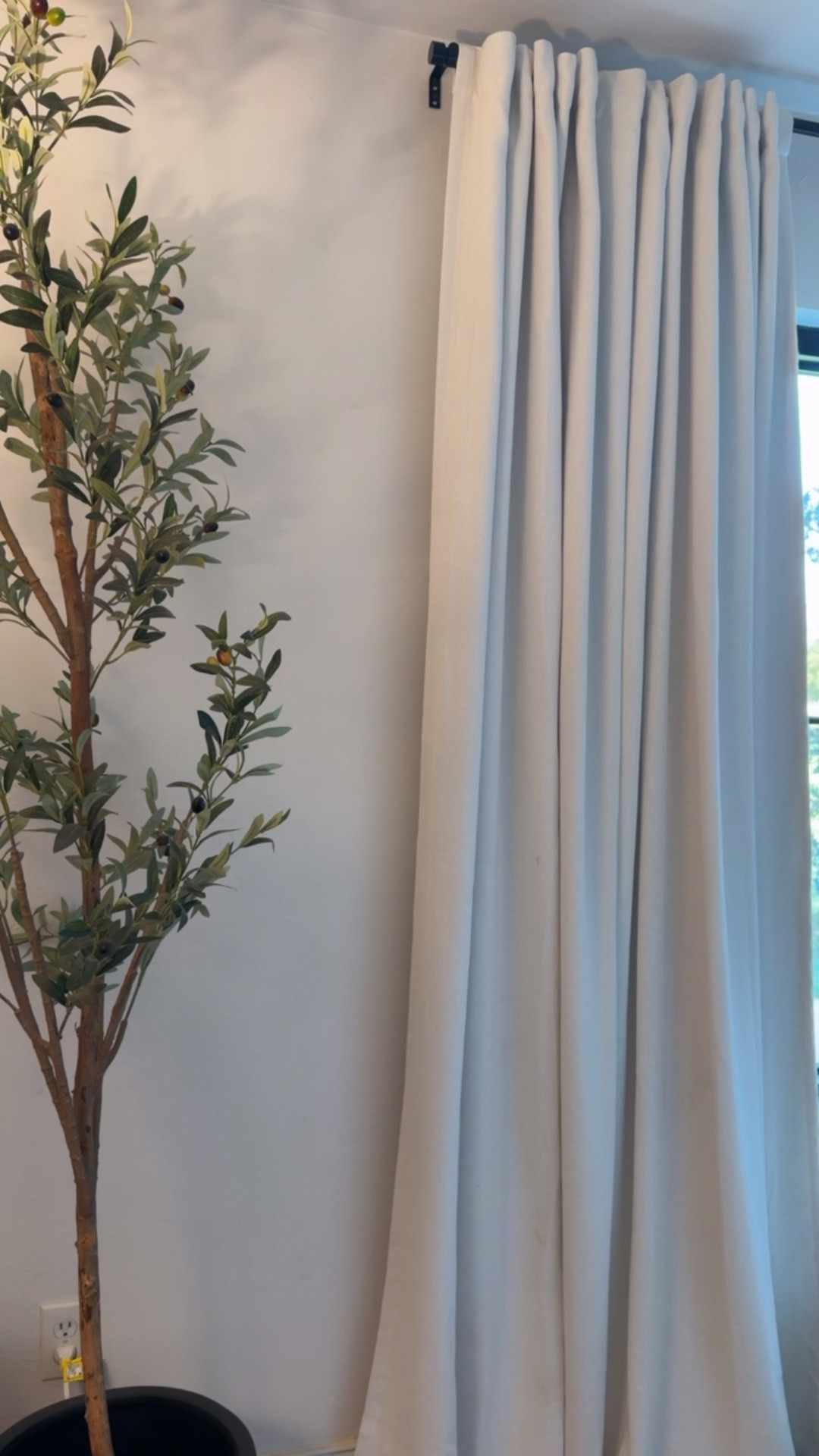 My faux olive tree is 7’ tall and my curtains are in the color sour cream. I have 8’ ceilings and hung them close to the ceiling to make my ceilings appear taller (I did the 95” length). 

#LTKHome #LTKSaleAlert