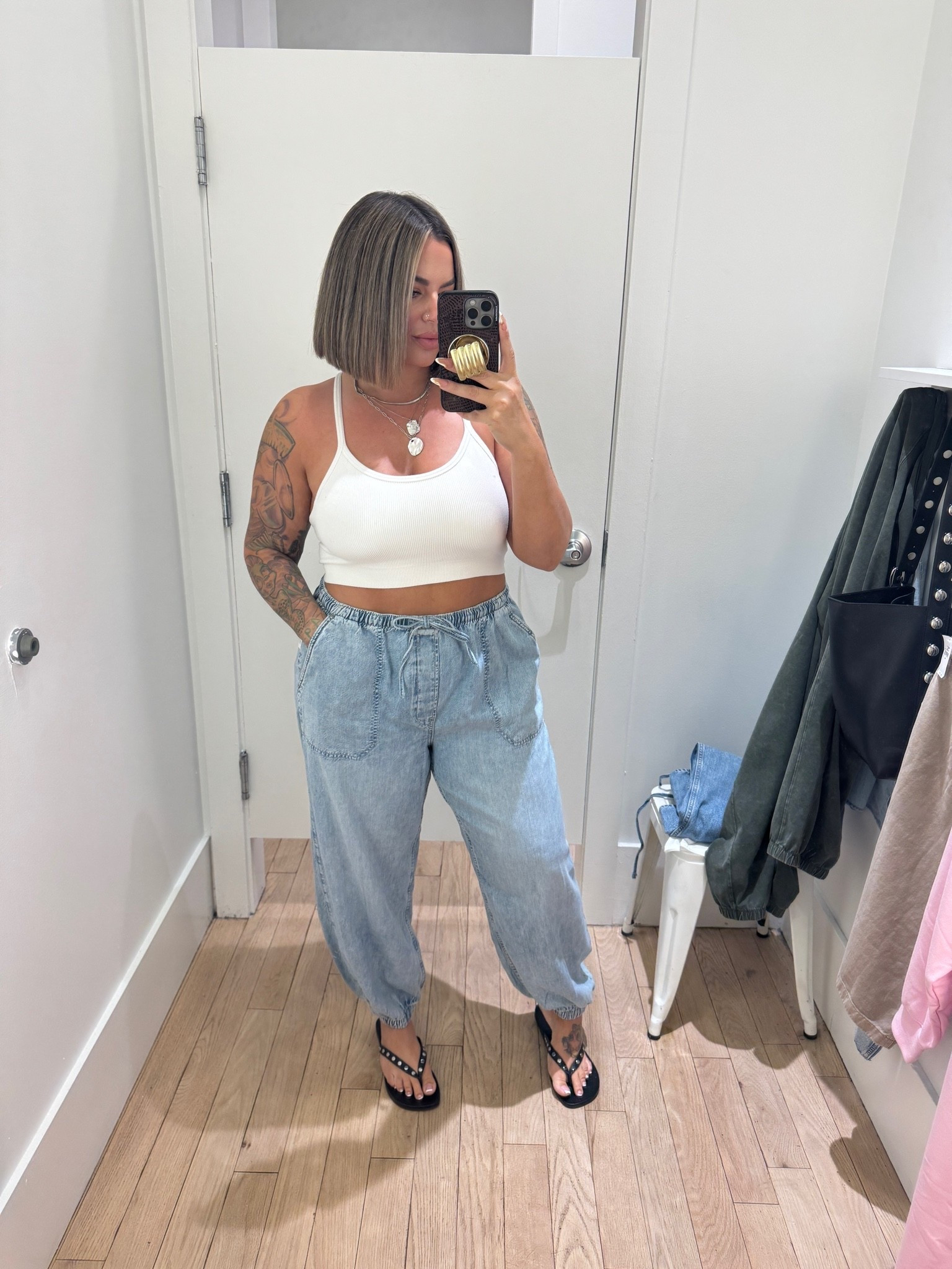 Jeans size up for a baggy oversized fit. I tried on L and XL L was more fitted and XL is relaxed. 
Wearing XL here super comfy these came home with me. 

Tank is old