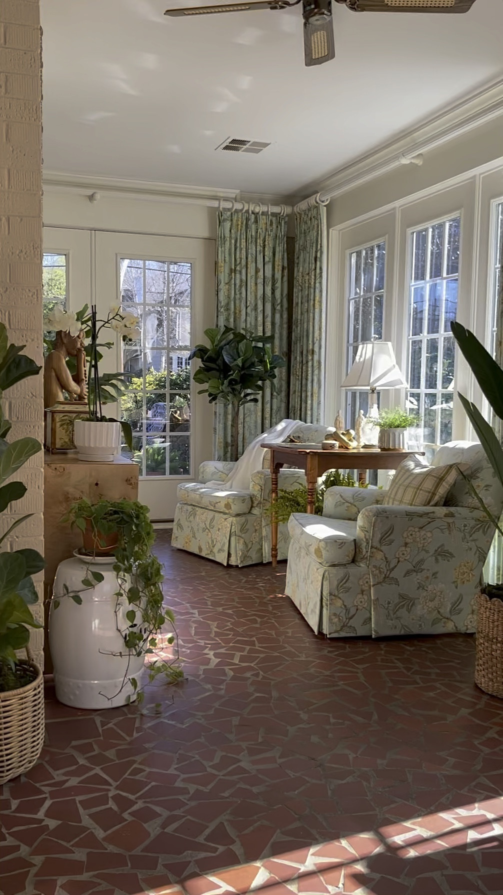 Basking in yesterday's golden rays, I captured the sun's fleeting embrace before today's gloomy forecast rolled in. 🌥️✨ Amidst this cozy sunroom oasis, many of you have inquired about the unique flooring underfoot. It's what they call cracked red tile— a vintage charm that harks back to the 1930s-60s era. The previous owners transformed what was once an open-air porch into this enclosed haven. Our little touch? Swapping out solid glass for paned windows, and oh, how it gave the space that sweet charm! Each time I share a snippet of this sun-drenched nook, it seems to stir up nostalgic tales from your childhood homes, which is absolutely heartwarming. Keep sharing those sweet memories.☀️🏡 
.
.
.
#thenewsouthern #southernlivingmag #southerninteriors #mycollectedlook #southernliving #betterhomesandgarden #storyofmyhome #thecottagejournal #myhousebeautiful #bhg #mybhg
#betterhomesandgardens #antiquehome #homebeautiful #traditionalhome #sunrooms #sunroomdecor #charminghome #lovelyhome #slhome #mytradhome #housebeautiful #houseandgarden #thecottagejournalmagazine #postitandsmile #bhghome #classicinterior #sunroom #classichome #wallofwindows

#LTKhome #LTKVideo #LTKstyletip