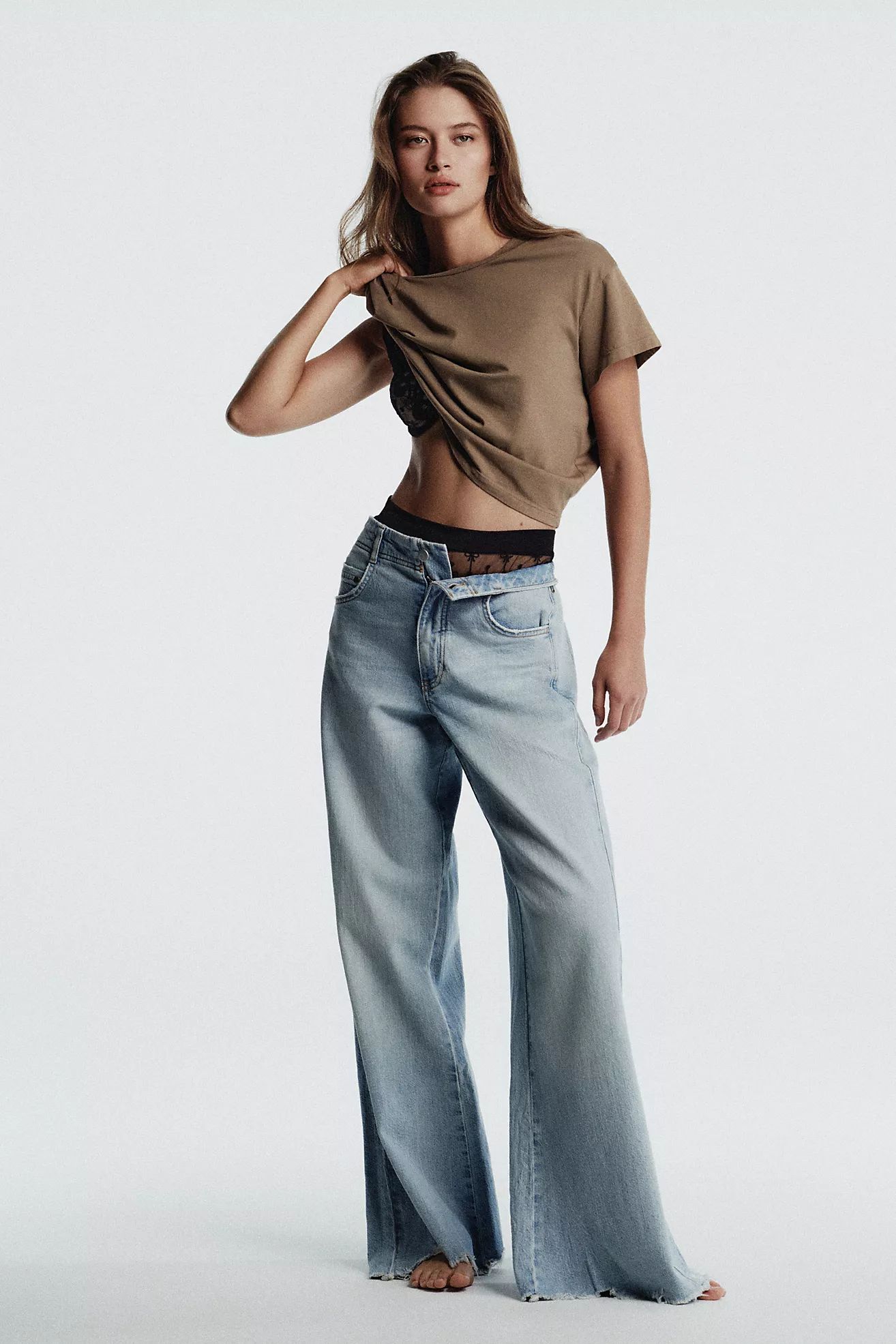 Pilcro Ella Mid-Rise Frayed Relaxed Flare Jeans | Anthropologie (US)
