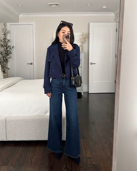 Navy Cropped trench coat just went on sale and is available in a few sizes 

 • Navy cropped crepe trench coat xxs - TTS, chic and on trend but also a timeless look. The sleeves are a little long for petites, and the crepe material feels nice and elegant.

• $99 soft wide leg Jeans - waist runs big! I ordered a size 00 which fits big on me at the waist and will need a belt or waist alterations. The 00 measures 26/26.5” at the waist, 10" rise, and 27.5" inseam. The denim fabric is very comfortable, soft and has stretch. The length works well on someone petite with a medium heel. 

• Edited Pieces belt (original width, xxs, fully stocked at editedpieces.com) 

• Stuart Weitzman suede ankle sock boots, linked current version 

• YSL bag 

#petite winter smart casual workwear

#LTKSeasonal #LTKsalealert #LTKworkwear
