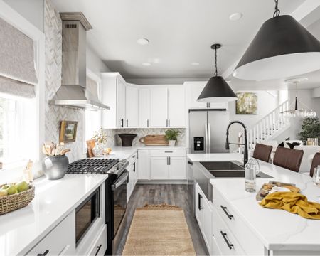 This all white kitchen is brought to life with matte black accents and a stunning herringbone backsplash.

#LTKhome