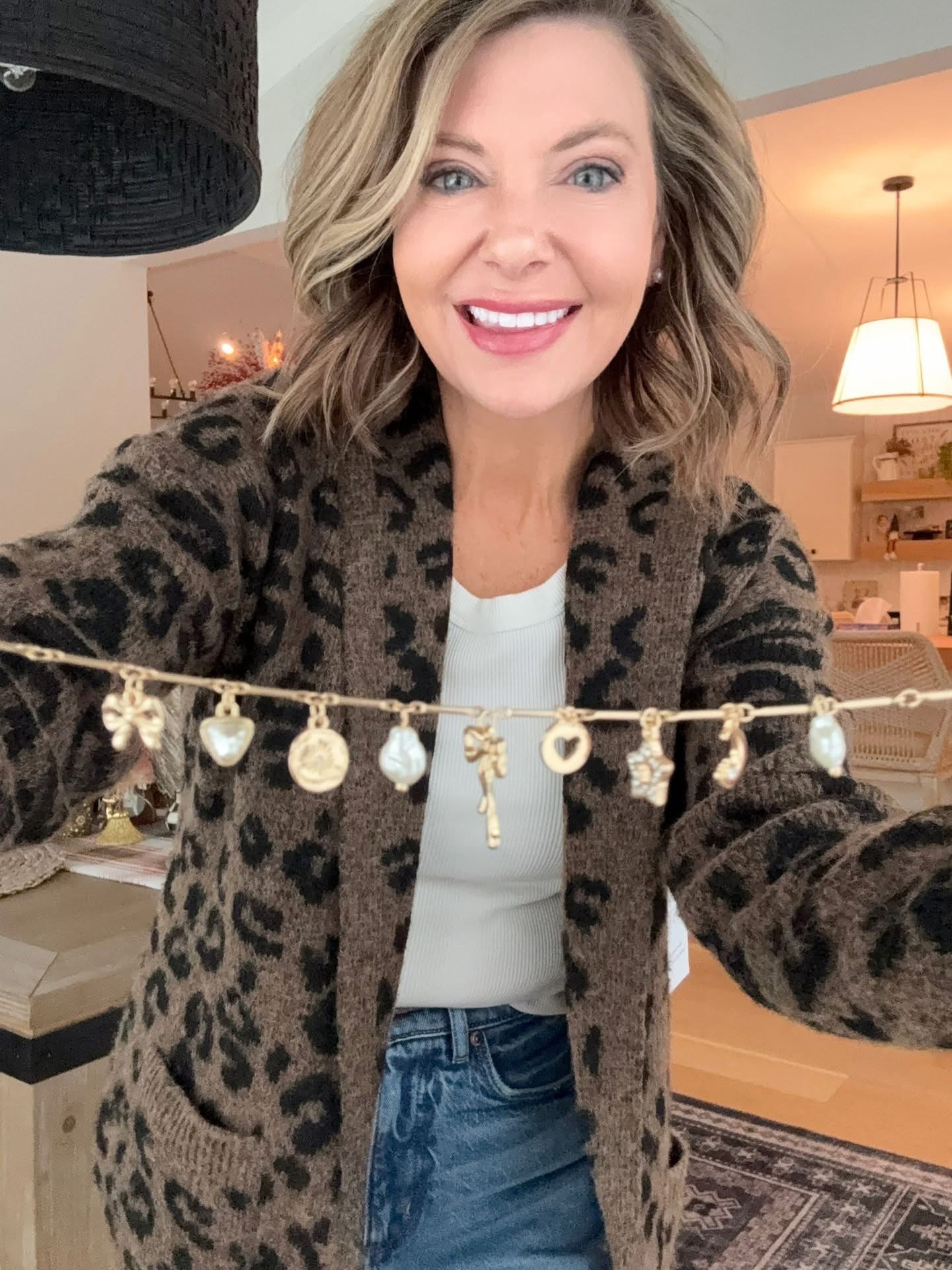 My cardigan is under $20 and my cute mini charm necklace is 50% off today! 

👇🔗 

#LTKHoliday #LTKdayinmylife #LTKgrwm