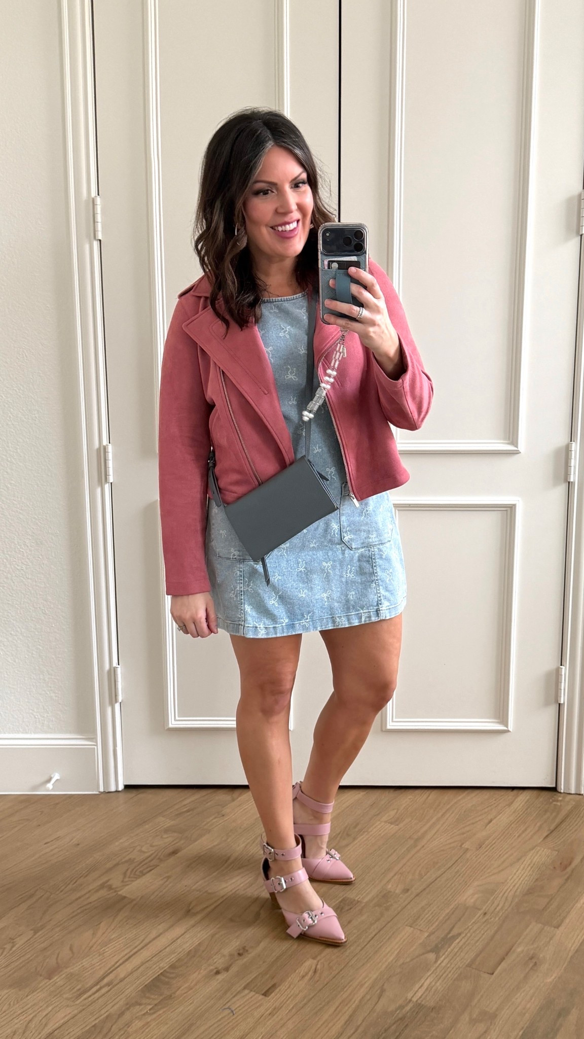 Night out with girlfriends to watch a comedian. Pink Musk jacket with denim dress. Dark blue grey purse and clover shoes  