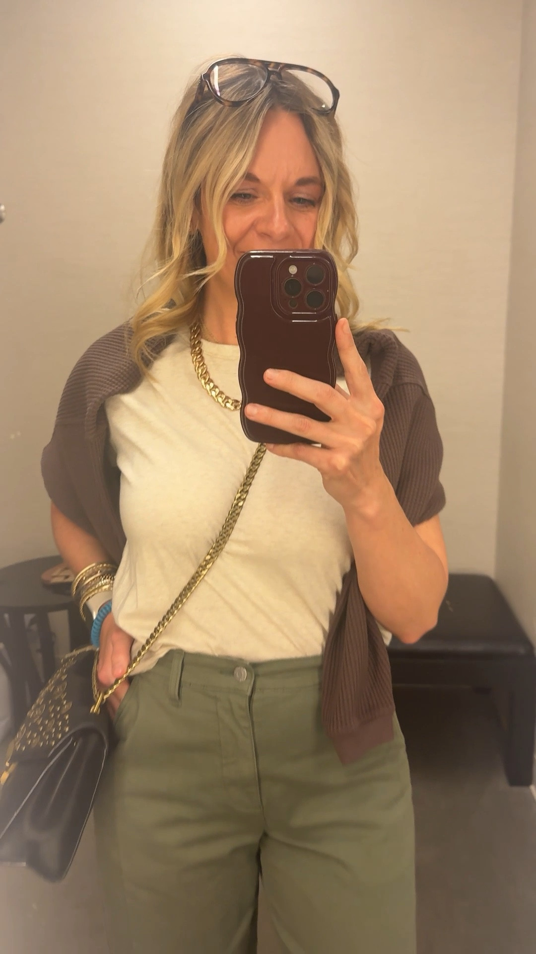 OOTD while setting up a dressing room for a client appointment ✨ Boxy neutral tee + olive barrel pants + brown waffle knit draped over the shoulders + mesh flats + gold accessories. All from my own closet — linked the exact pieces where I can and the closest versions where I can’t. Everything shoppable below! 👇

#LTKdayinmylife #LTKootd #LTKOver40
