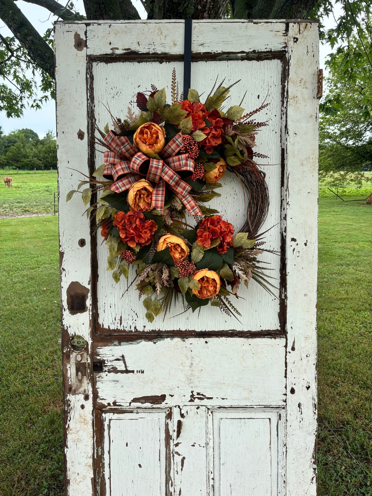 From an empty grapevine to a stunning front door statement, watch this gorgeous autumn wreath come together with warm florals, rich textures, and the prettiest plaid bow. 🍁🤎

The finished wreath is now available in our Etsy shop!

#LTKU #LTKSeasonal #LTKHome