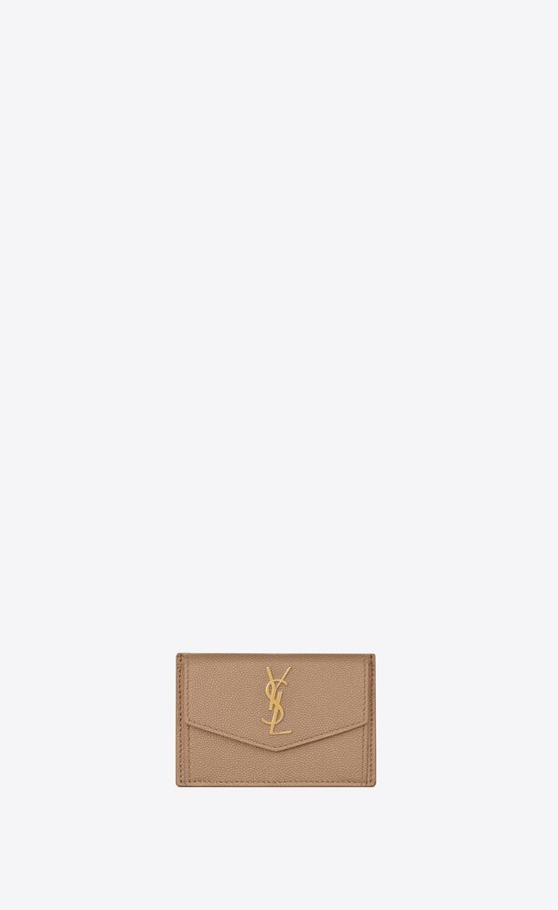 CARD CASE WITH FLAP, DECORATED WITH ICONIC YSL SIGNATURE. | Saint Laurent Inc. (Global)