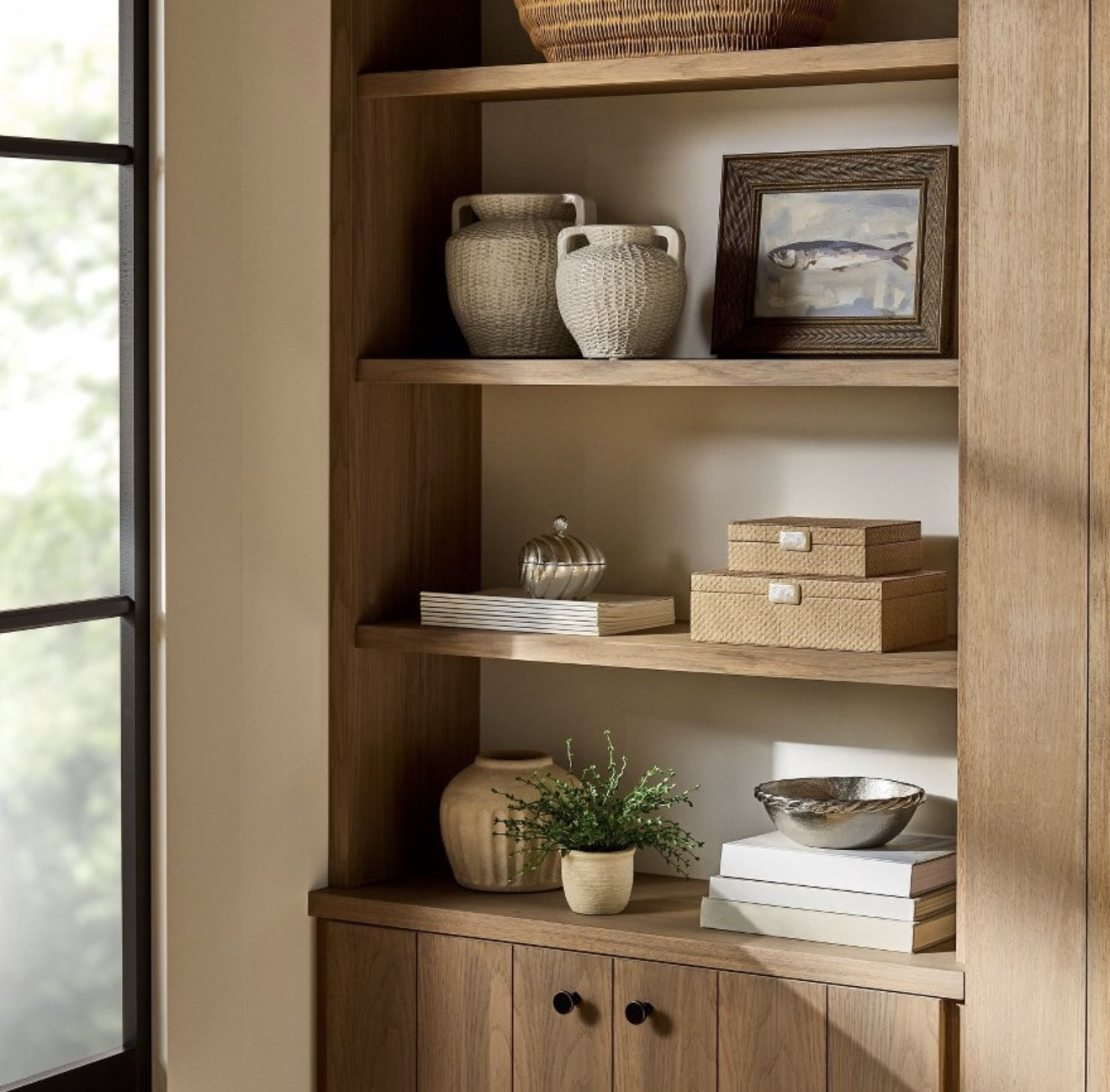 Styled shelves done right 🤍 A mix of ceramics, woven accents, and simple artwork keeps this look balanced and timeless.

#LTKHome