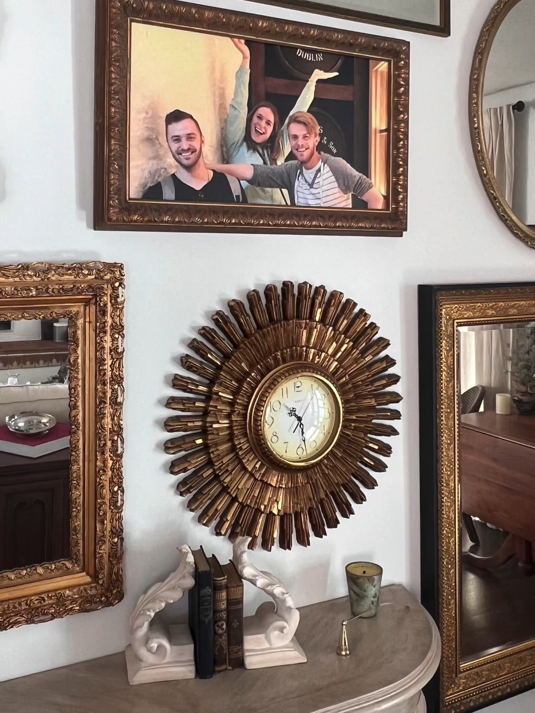 I never tire of a great gallery wall! 

Especially when it includes a personal touch! One favorite family   candid photo broke up the formality of all the ornate gold frames. 

I used large mirrors to help maximize light in this room that is naturally rather dark. And took them floor to ceiling. 

Notice the variety of shapes, shades of gold and weight of frames. This keeps a gallery interesting. 

#mirrorgallerywall #gallerywall #mirrors #familypicwallart #goldframes #ornatevintageframes



#LTKVideo #LTKhome