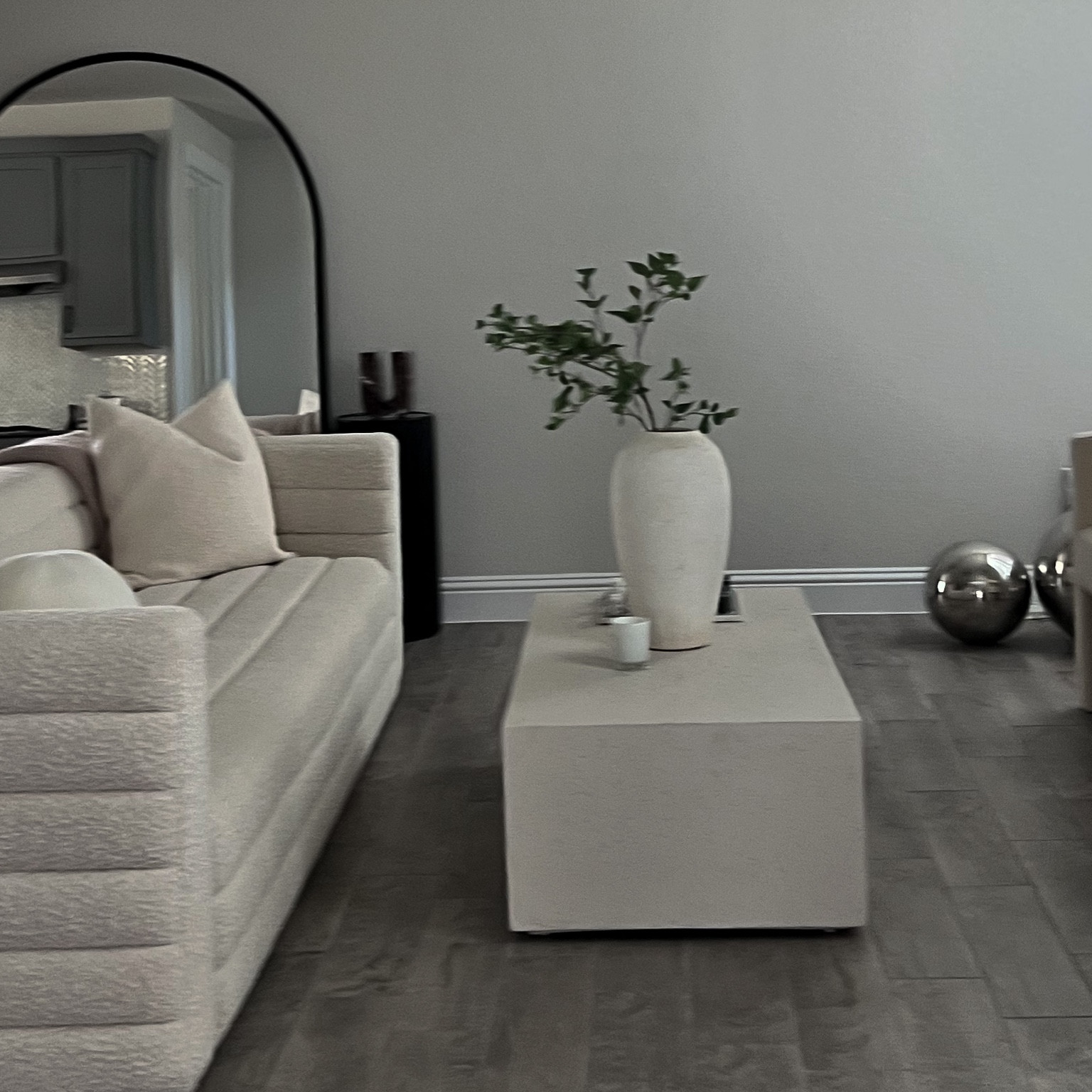 Coffee Table, Neutral Coffee Table, cement coffee table, neutral living room, neutral home decor, boucle couch, arch mirror, decor vases 

#LTKFind #LTKhome #LTKstyletip