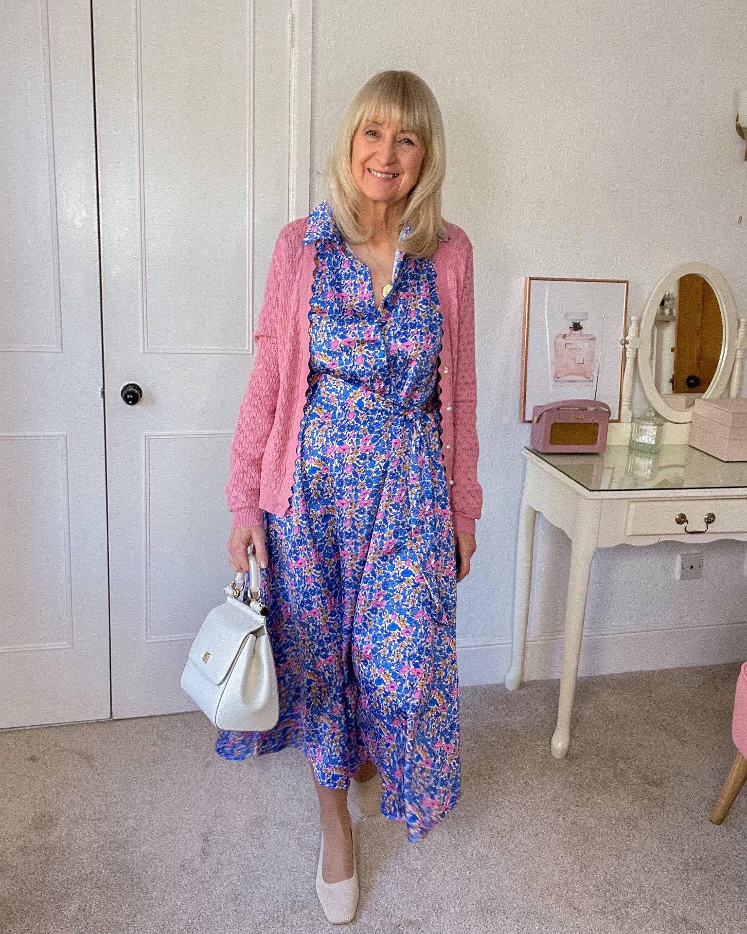 Spring Ready Look 🌸
Blue floral Ditsy midi print shirt dress, pink cardigan, white Sicily D&G bag and cream block heel court shoes. 

#LTKeurope #LTKSeasonal #LTKitbag