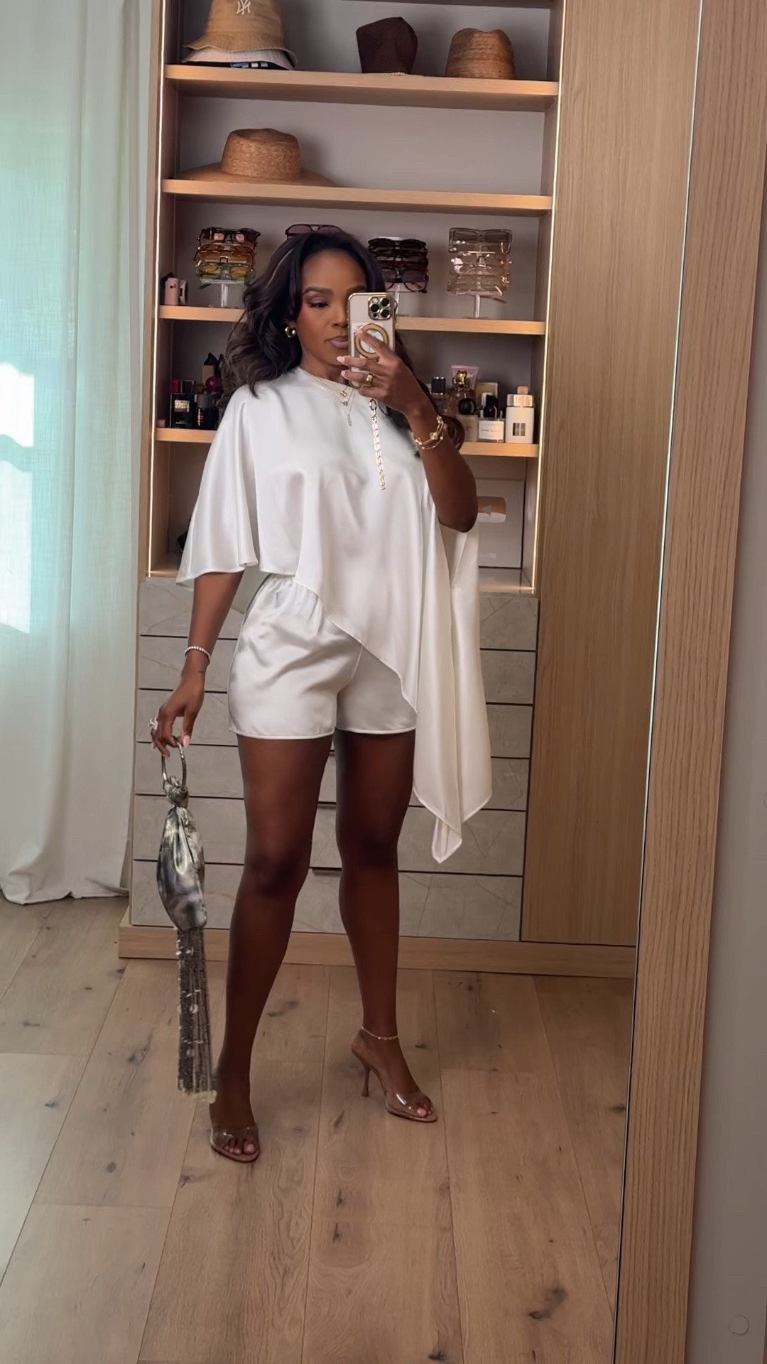 Hi Babes! 🤍✨

This white set is giving effortless luxury! The flowy asymmetrical top paired with the matching shorts is one of those outfits that looks so elevated with minimal effort. Perfect for summer events, vacations, or whenever you want to make a statement while staying comfortable.

✨ Fit Details:
• Wearing a size Small
• Flowy asymmetrical draped top
• Matching high-waisted shorts
• Lightweight fabric with an elegant drape
• Styled with clear heels, gold jewelry, and a metallic statement bag

🤍 Where to Wear:
• Vacation dinners
• Resort nights
• Bridal events
• Birthday celebrations
• Summer parties
• Date night

This is one of those sets you'll reach for anytime you want an expensive-looking outfit that's comfortable and chic!

Everything is linked below!

xx, Kira | IG: KirasFashionFinds

Measurements:
Kira: 5'4" | Size Small | 140 lbs