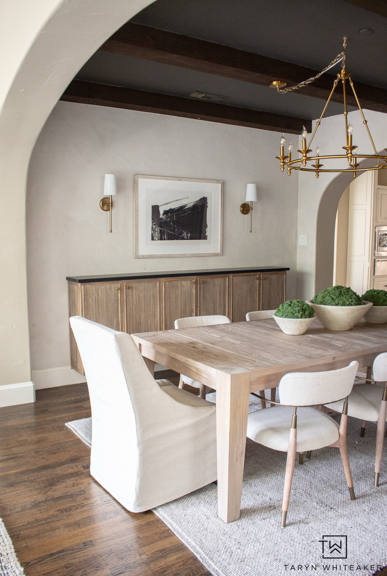 I love keeping the dining room simple and neutral. Wood dining table, neutral dining chairs, brass lighting, and minimal decor for an easy, elevated look.

#LTKU #LTKSeasonal #LTKHome