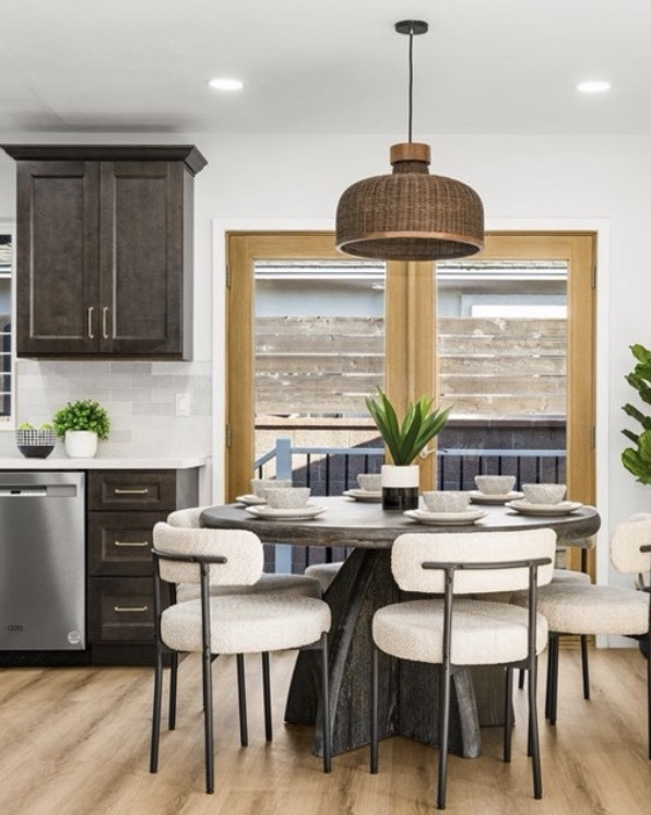 Loved staging this home. Flippers went with darker cabinets, and we played them up. Loved how moody the kitchen felt but still bright and airy. 

Organic modern meets modern contemporary. Kitchen decor, dining room decor, living room decor 
Modern living room, modern artwork

#LTKHome