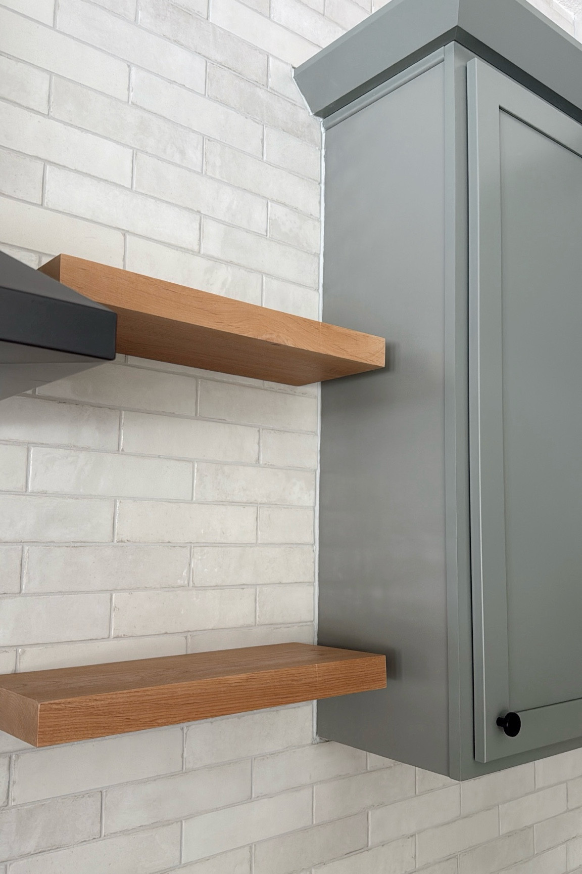 Details from the Johnston Pool House project! The perfect natural wood toned floating shelves!!!  Ordered raw unfinished alder wood with a clear coat finish. Matte black cabinet knob hardware and white textured subway tile for the kitchen backsplash. See more from this project on my Instagram @Simmoneclock 🤍

#LTKHome #LTKStyleTip