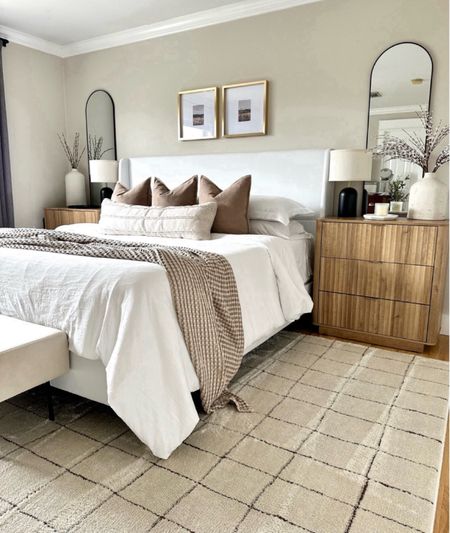 Bedroom refresh, fluted nightstand, upholstered bed, neutral rug, arch mirror, black lamps, neutral bedding, gold gallery frames, bedroom inspo 