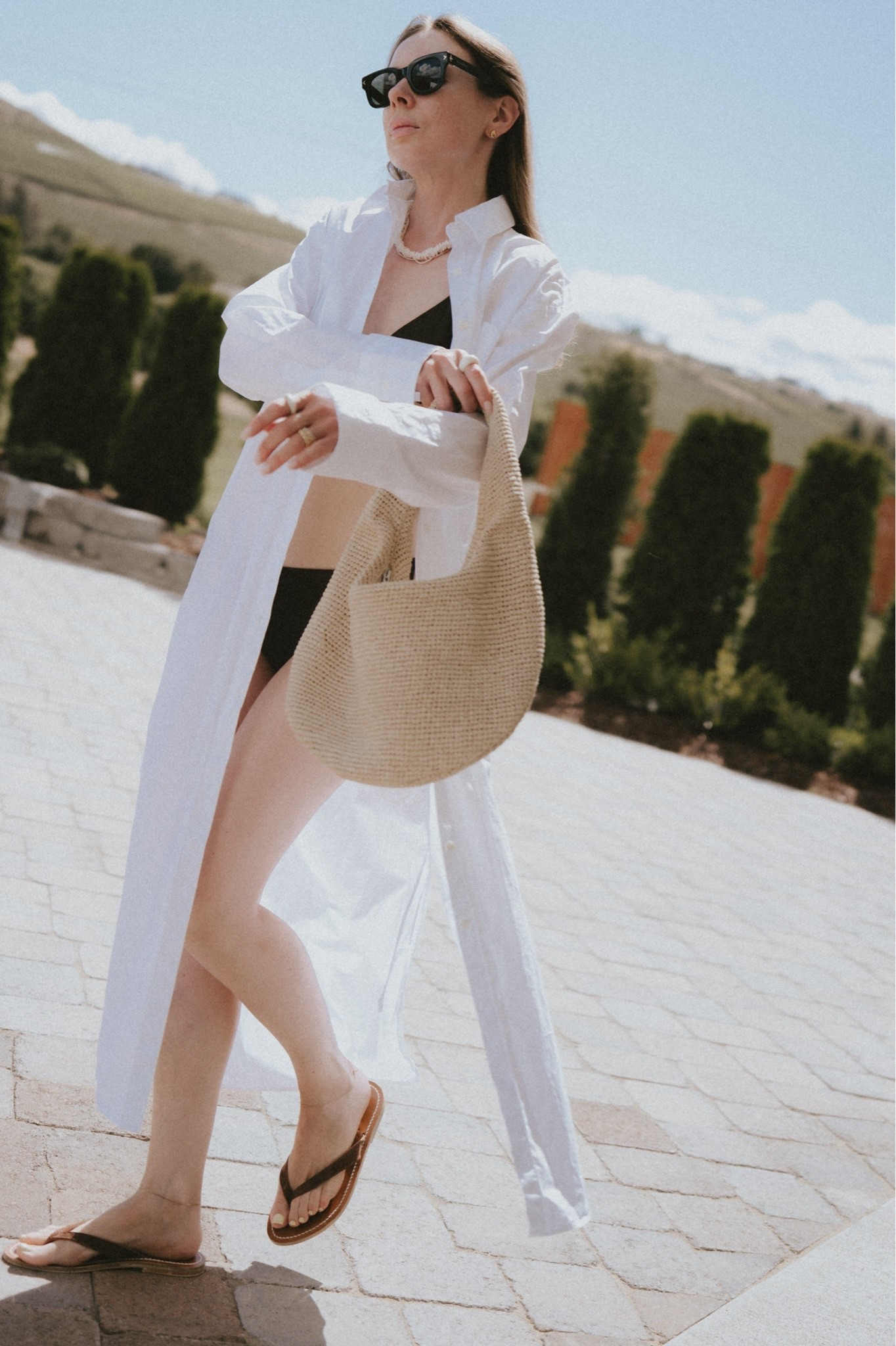 Vacation mode engaged: flip flops + raffia hobo bag + shirt dress + bikinis. 
Dress: The Frankie Shop
Bag: COS 
Flip flop sandals: K. Jacques St. Tropez 
Swimsuit: Faithful The Brand

#LTKSeasonal #LTKSwim #LTKTravel