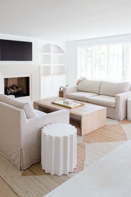 Our neutral living room is coming together, everything is linked below! Oatmeal sofas, light wood coffee table, and white round end tables. 

#LTKhome
