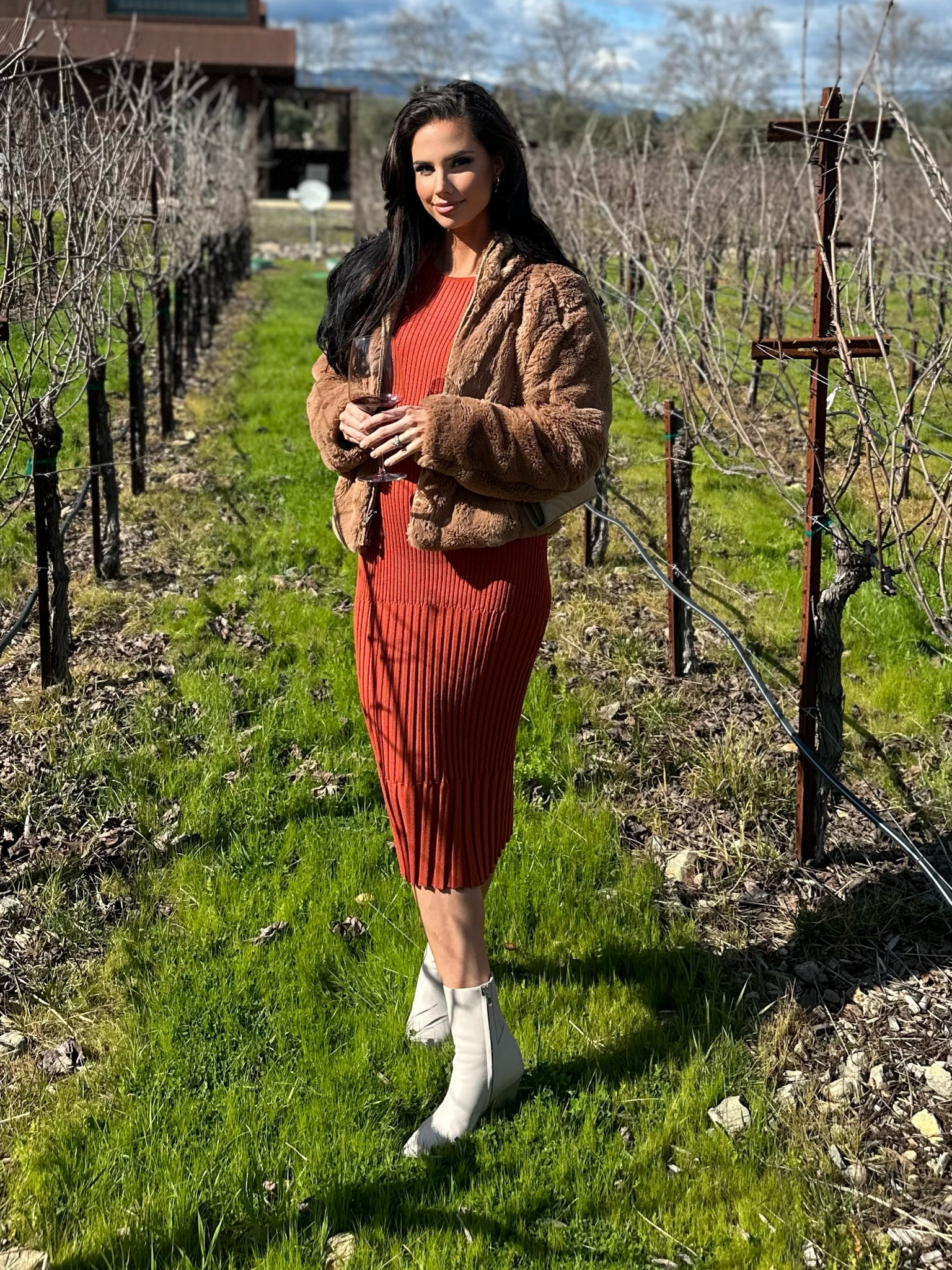 Burnt orange ribbed knit dress, brown faux fur jacket, booties, and gold earrings. Linked as much as I could. 

#LTKtravel #LTKshoecrush #LTKstyletip