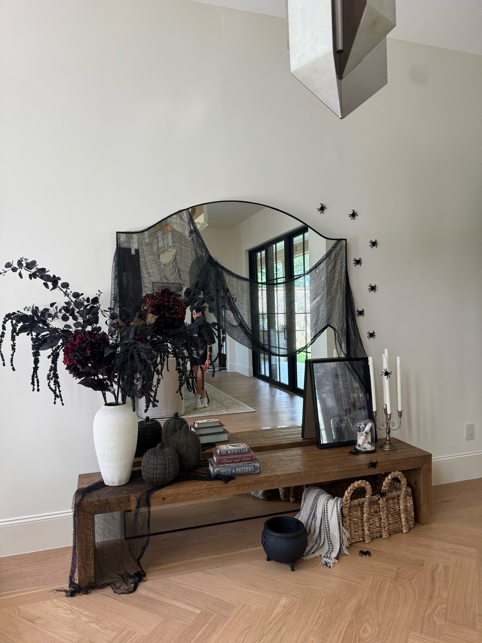 A few Michaels finds = a completely different entryway. 🖤 I shopped the Conjuring Nightfall collection for classic Halloween decor that still feels elevated. Halloween starts now shop Michaels and get inspired! @michaelsstores #MichaelsPartner