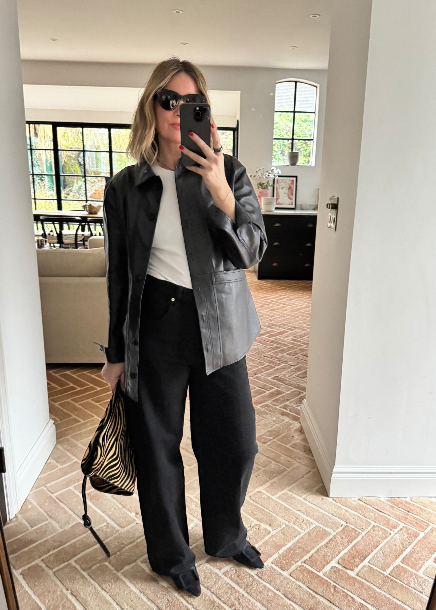 Baggy Jeans + Leather Shirt + Zebra Bag 

#LTKFashionMonth #LTKspring #LTKuk