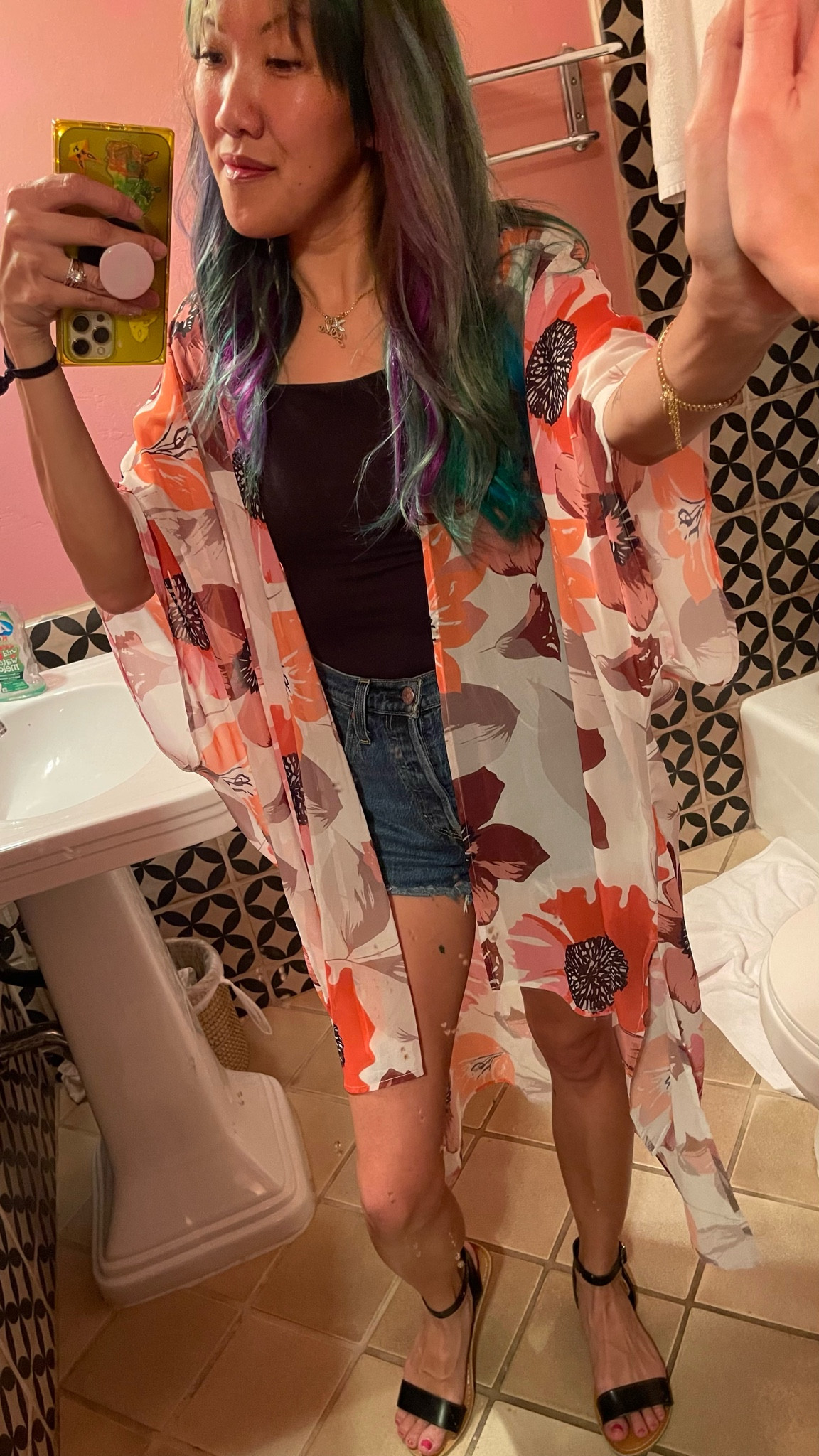 Vaycay mode activated! This floral printed orange, rust, beige, and pink kimono (beach coverup can be worn over a shirt or tank top) goes with the vibe of this retro Cuban themed hotel. This would make a comfy travel day outfit too!

The outfit underneath consists of my favorite go to cut off denim jean shorts, a fitted double lined (upper) t-shirt scoop neck top. I’ve linked the exact outfit as well as all the other photos I bought on this trip under "similar”

#LTKtravel #LTKstyletip #LTKSeasonal