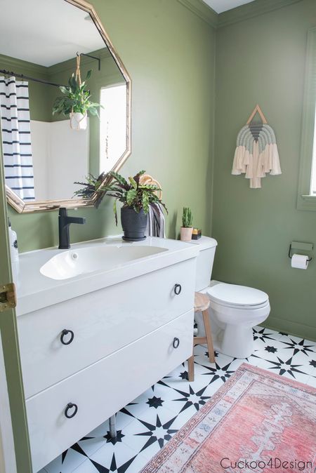 Other view of our bathroom with black and white tiles, green walls, and white vanity with drawers #bathroomdecor #bathroomdesign

#LTKStyleTip #LTKSaleAlert #LTKHome