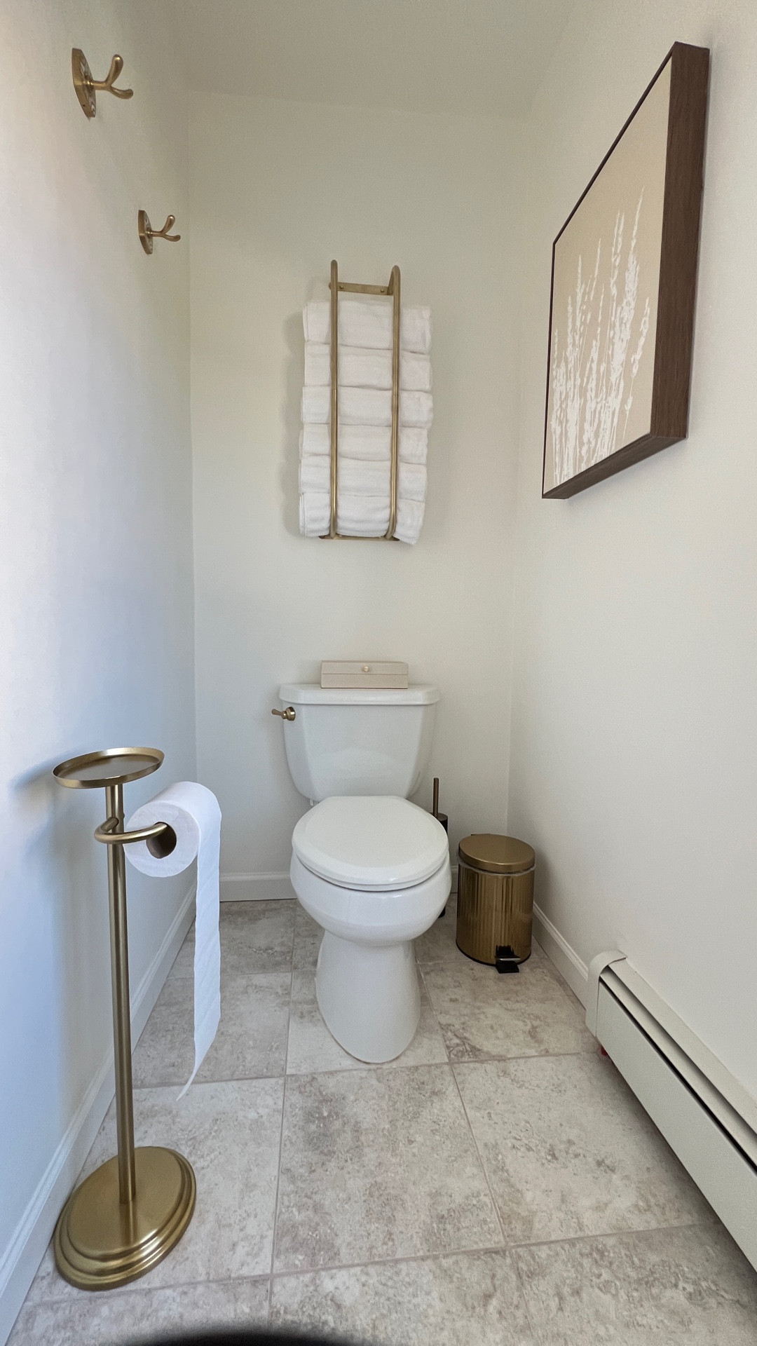 Neutral bathroom decor ideas. Add a towel holder rack, freestanding toilet paper holder, and new gold toilet handle! 
*Instagram reel post 12/12/25

#LTKHome #LTKselfcare #LTKOver40