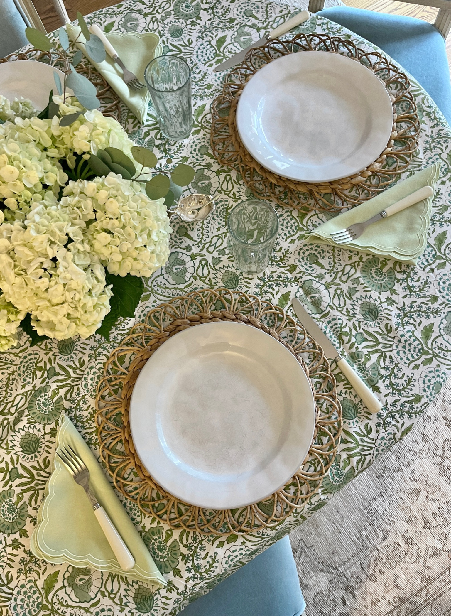 Greens + rattan + blown Mexican glass = simple summer table. Silver cabbage leaf salt cellars is old Williams-Sonoma, similar linked. 

#LTKParties #LTKFamily #LTKHome