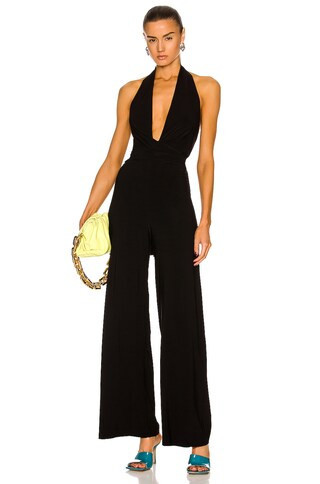 Norma Kamali Halter Wrap Straight Leg Jumpsuit in Black - Black. Size L (also in XL). | FWRD 