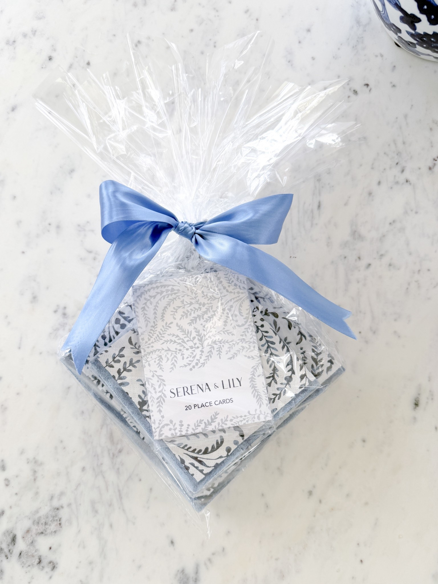 An easy & traditional blue & white hostess gift that she’s sure to use & a perfect go to to keep in your hosting closet for whenever you need to bring a gift as a small gesture. If you’re looking for a nice & thoughtful hostess gift for someone who loves all things Serena & Lily - I love the idea of gifting coordinated cocktail & lunch napkins (or guest napkins) paired with a matching set of place cards because you know these will get used. The napkins comes in three sizes and two different patterns. I wrapped these up in an oversized cellophane bag, tied it with a satin ribbon, and snipped the excess cellophane. I love presenting hostess gifts in clear packaging because it makes for a quicker & easier gifting experience for you & the host. It’s great because you still get that little moment of giving a thoughtful gift & getting the same experience of seeing them opening it in front of you, without them having to do any of the work of opening or disposing any gift wrap while they’re entertaining. 

#LTKHome #LTKSeasonal