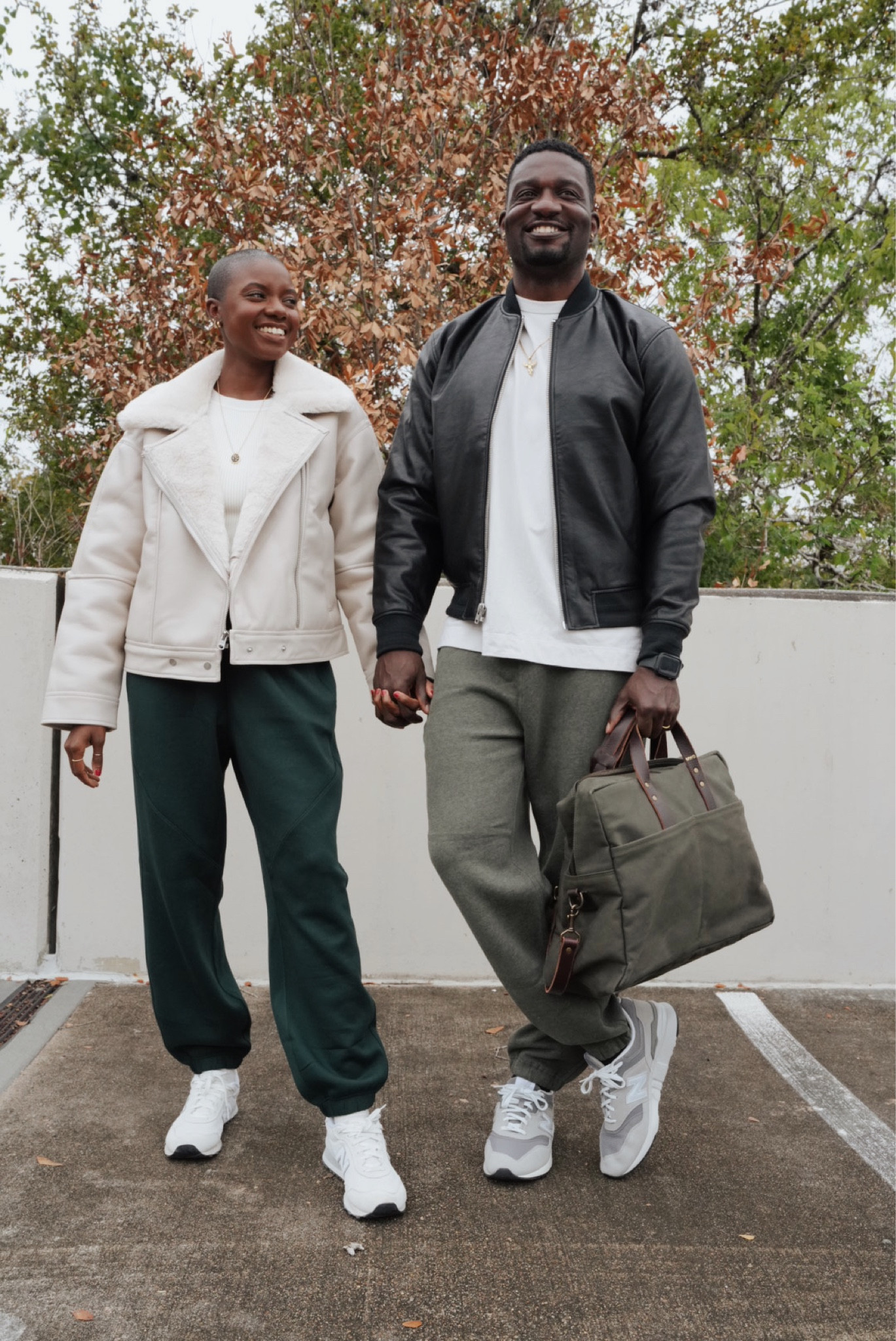 Couples fall outfits! Cropped faux leather cream jacket, olive green sweat pants, cream ribbed bodysuit and white New Balance sneakers for her. Black faux leather vegan bomber jacket, cream T-shirt, olive heathered sweat pants, and grey & white retro new balance sneakers  

#LTKfamily #LTKmens #LTKSeasonal